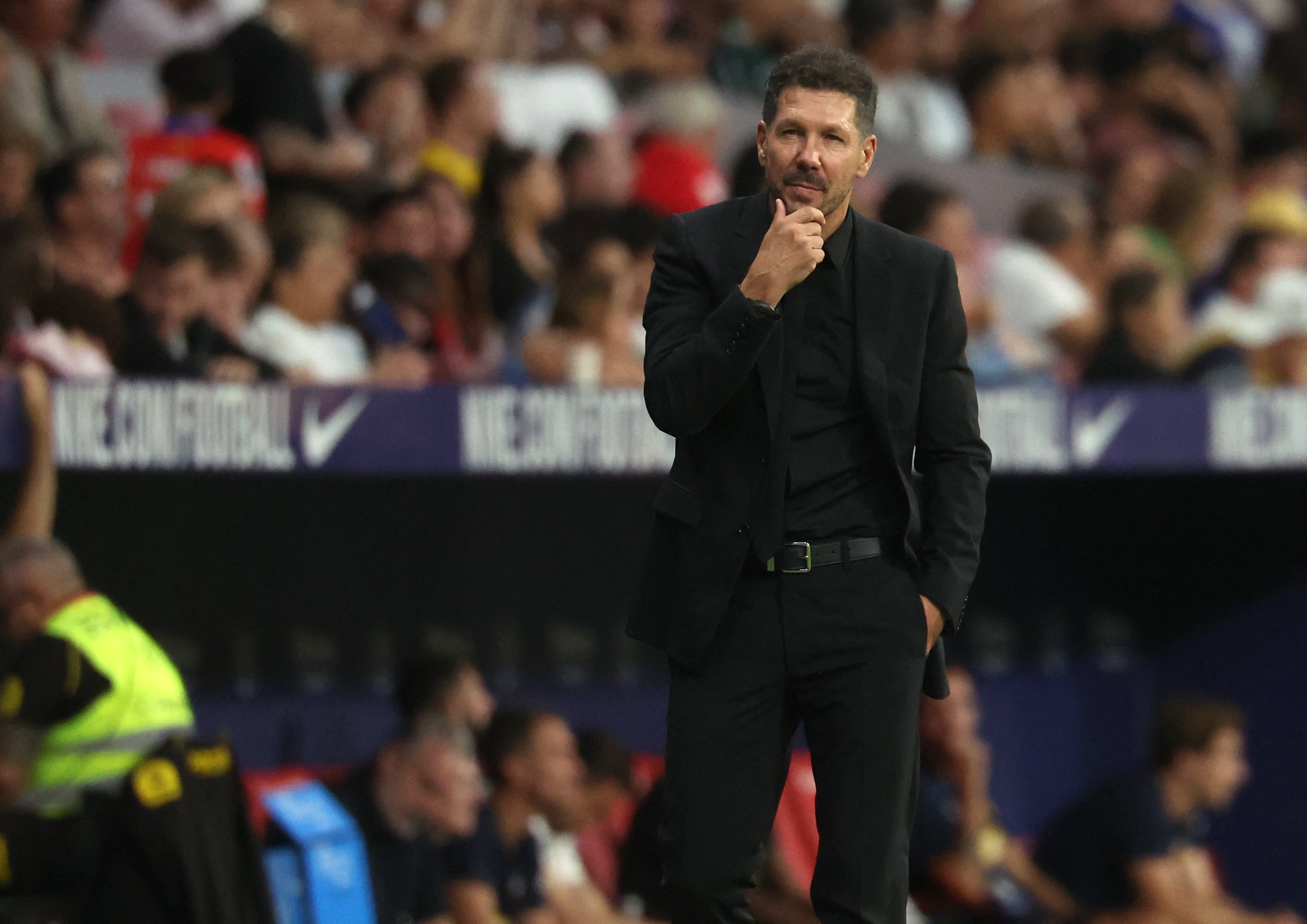 Atletico Madrid's Argentine coach Diego Simeone watches his players from the touchline during the Spanish league football match between Club Atletico de Madrid and Valencia CF at the Metropolitano stadium in Madrid on September 15, 2024. (Photo by Pierre-Philippe MARCOU / AFP)