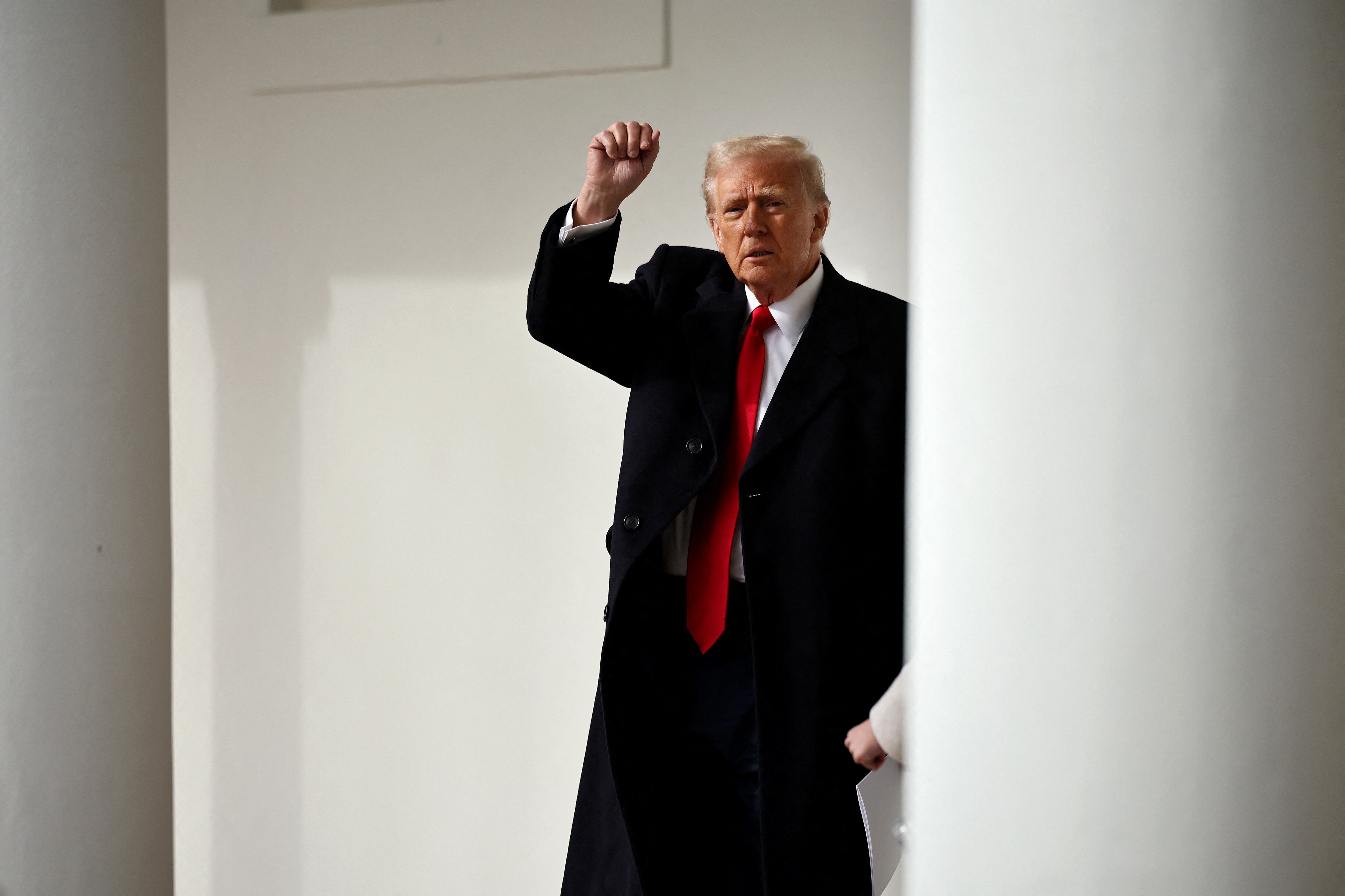 WASHINGTON, DC - JANUARY 21: U.S. President Donald Trump speaks briefly with reporters after returning to the White House after attending the National Prayer Service at the National Cathedral on January 21, 2025 in Washington, DC. Tuesday marks the first full day Trump's second term in the White House. Chip Somodevilla/Getty Images/AFP (Photo by CHIP SOMODEVILLA / GETTY IMAGES NORTH AMERICA / Getty Images via AFP)