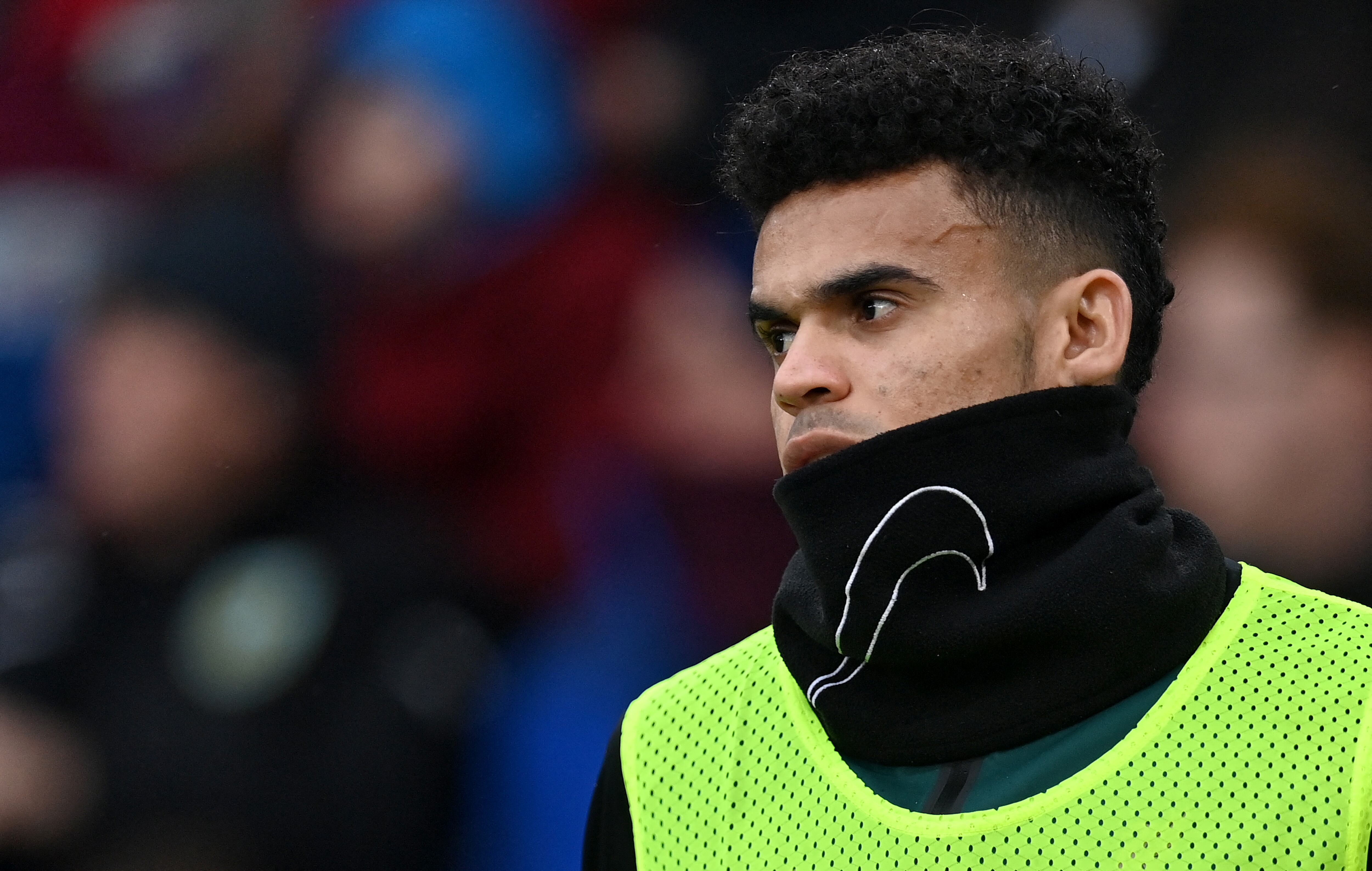 Liverpool's Colombian midfielder Luis Diaz warms up on the side of the pitch during the English Premier League football match between Burnley and Liverpool at Turf Moor in Burnley, north west England on February 13, 2022. (Photo by Paul ELLIS / AFP) / RESTRICTED TO EDITORIAL USE. No use with unauthorized audio, video, data, fixture lists, club/league logos or 'live' services. Online in-match use limited to 120 images. An additional 40 images may be used in extra time. No video emulation. Social media in-match use limited to 120 images. An additional 40 images may be used in extra time. No use in betting publications, games or single club/league/player publications. /