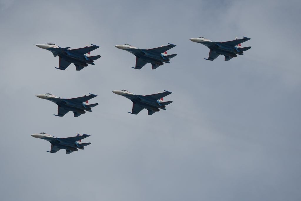 ZHUHAI, CHINA - NOVEMBER 09: Sukhoi Su-35S multirole fighter jets of Russian Knights aerobatic team conduct adaptive training for the upcoming 15th China International Aviation and Aerospace Exhibition, or Airshow China 2024, on November 9, 2024 in Zhuhai, Guangdong Province of China. The 15th China International Aviation and Aerospace Exhibition will be held in Zhuhai from November 12 to 17. (Photo by Zhou Guoqiang/VCG via Getty Images)