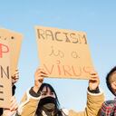 Group of multiracial people protest on the street against racism - Demonstrators from different asian countries fight for equal rights - Stop asian hate fight campaign concept