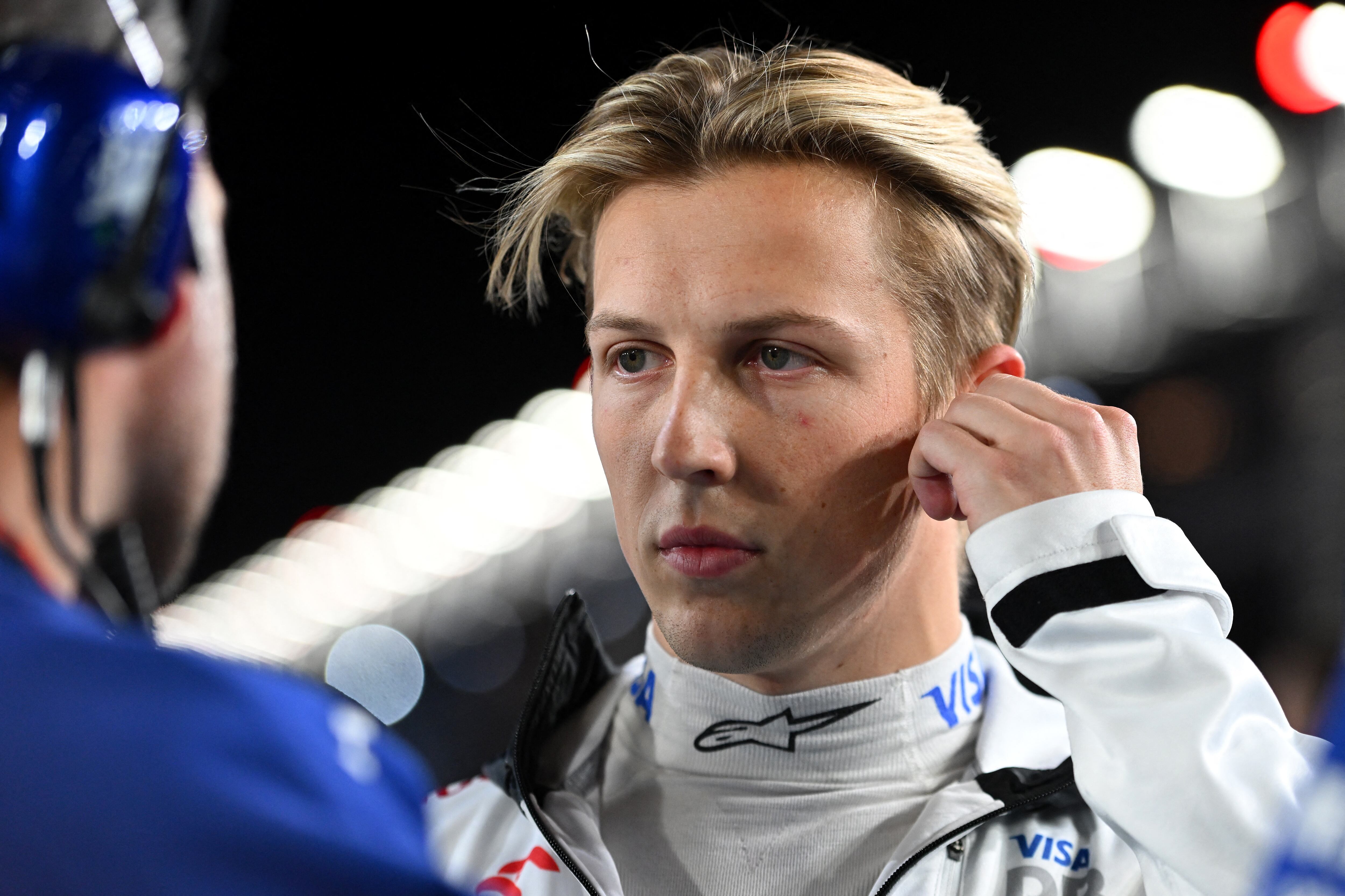 (FILES) LAS VEGAS, NEVADA - NOVEMBER 23: Liam Lawson of New Zealand and Visa Cash App RB looks on from the grid during the F1 Grand Prix of Las Vegas at Las Vegas Strip Circuit on November 23, 2024 in Las Vegas, Nevada.   Rudy Carezzevoli/Getty Images/AFP. New Zealand driver Liam Lawson will team up with Dutchman Max Verstappen, the four-time reigning Formula 1 world champion, at Red Bull next season, the Austrian team announced on December 19, 2024. (Photo by Rudy Carezzevoli / GETTY IMAGES NORTH AMERICA / AFP)