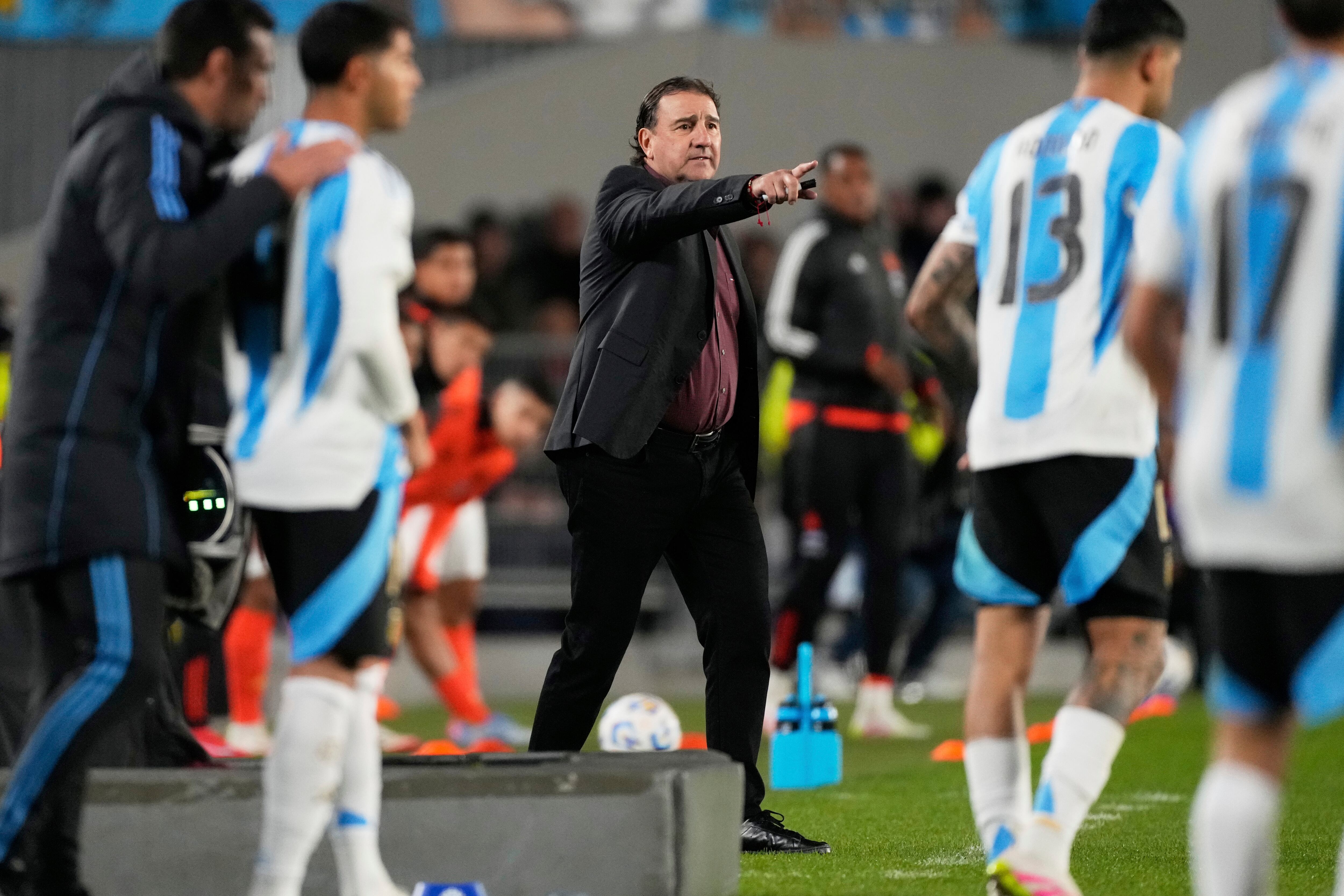Colombia's coach Nestor Lorenzo, center, gives instructions during a qualifying soccer match against Argentina for the FIFA World Cup 2026 at the Monumental stadium in Buenos Aires, Argentina, Tuesday, June 10, 2025. (AP Photo/Gustavo Garello)