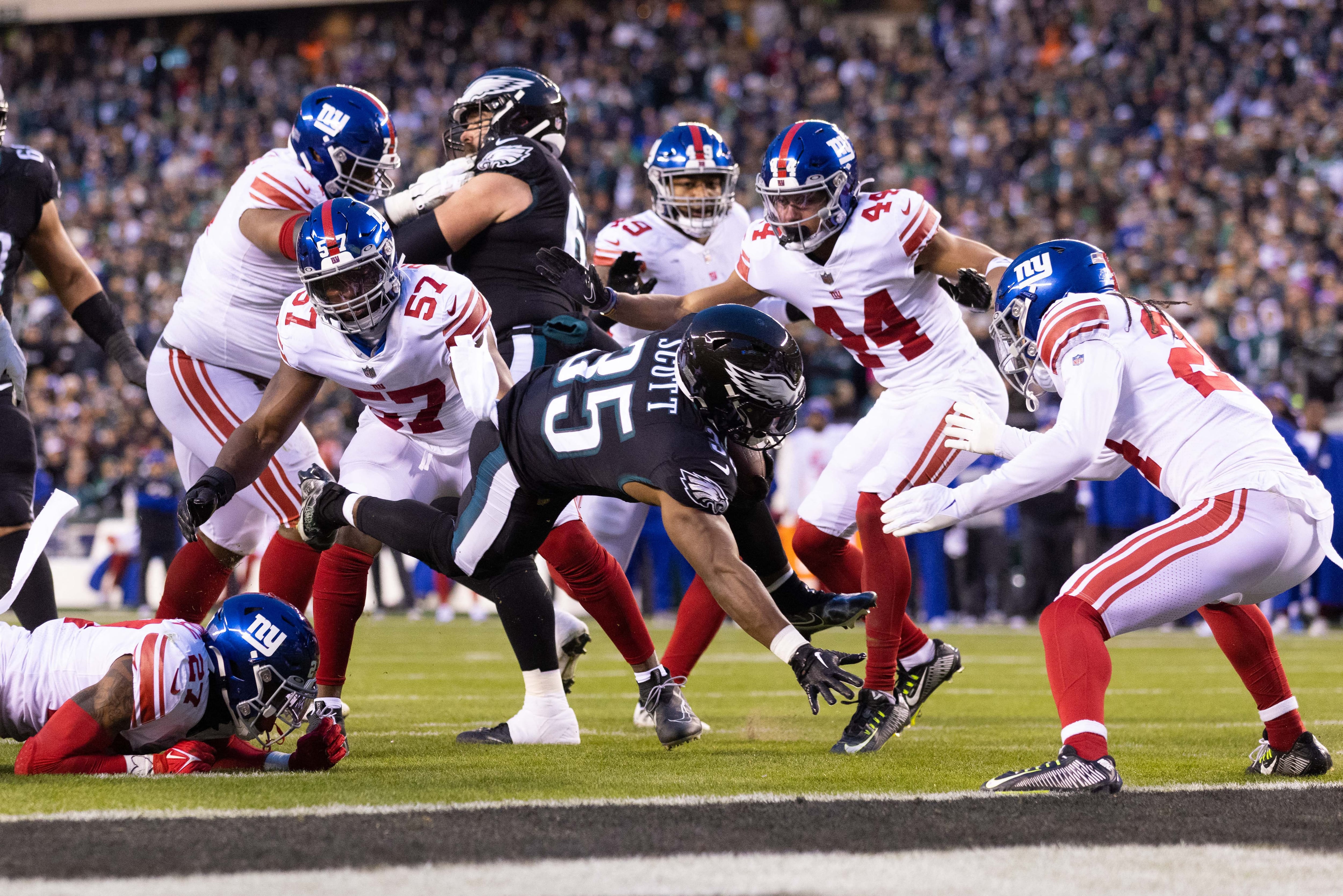 Jan 8, 2023; Philadelphia, Pennsylvania, USA; Philadelphia Eagles running back Boston Scott (35) runs for a touchdown against the New York Giants during the first quarter at Lincoln Financial Field. Mandatory Credit: Bill Streicher-USA TODAY Sports