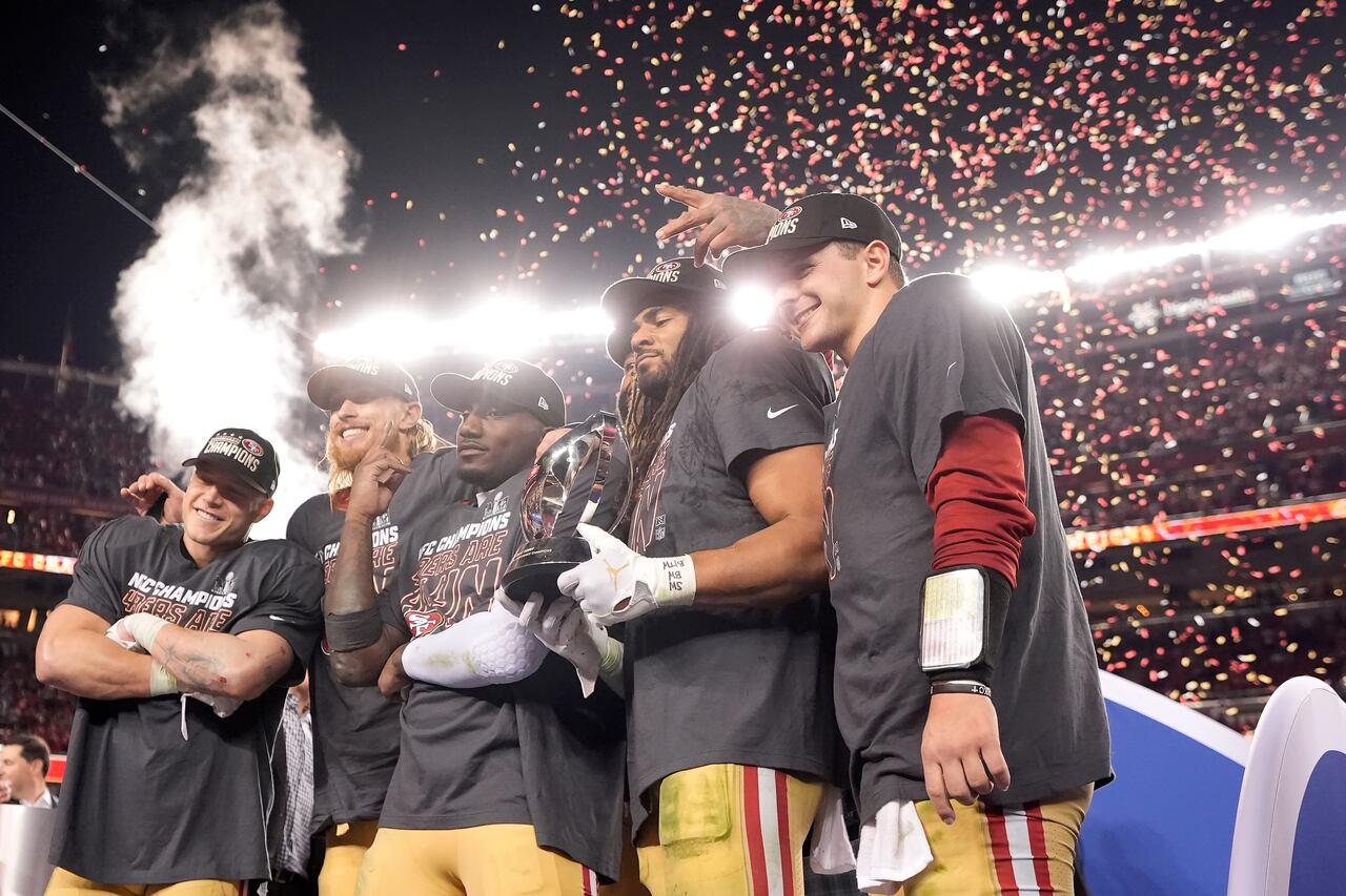 San Francisco 49ers running back Christian McCaffrey, from left, celebrates with tight end George Kittle, wide receiver Deebo Samuel, linebacker Fred Warner and quarterback Brock Purdy after the NFC Championship NFL football game against the Detroit Lions in Santa Clara, Calif., Sunday, Jan. 28, 2024. (AP Photo/Mark J. Terrill)