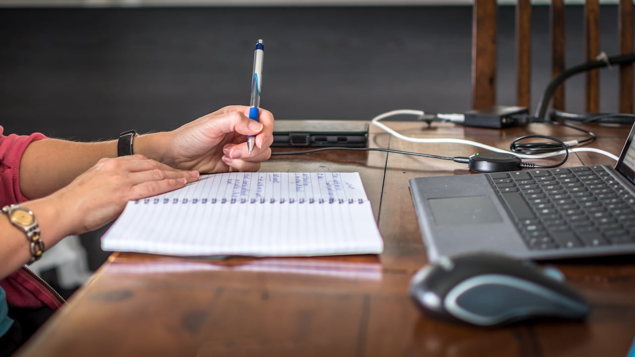 A young person working remotely in a home office