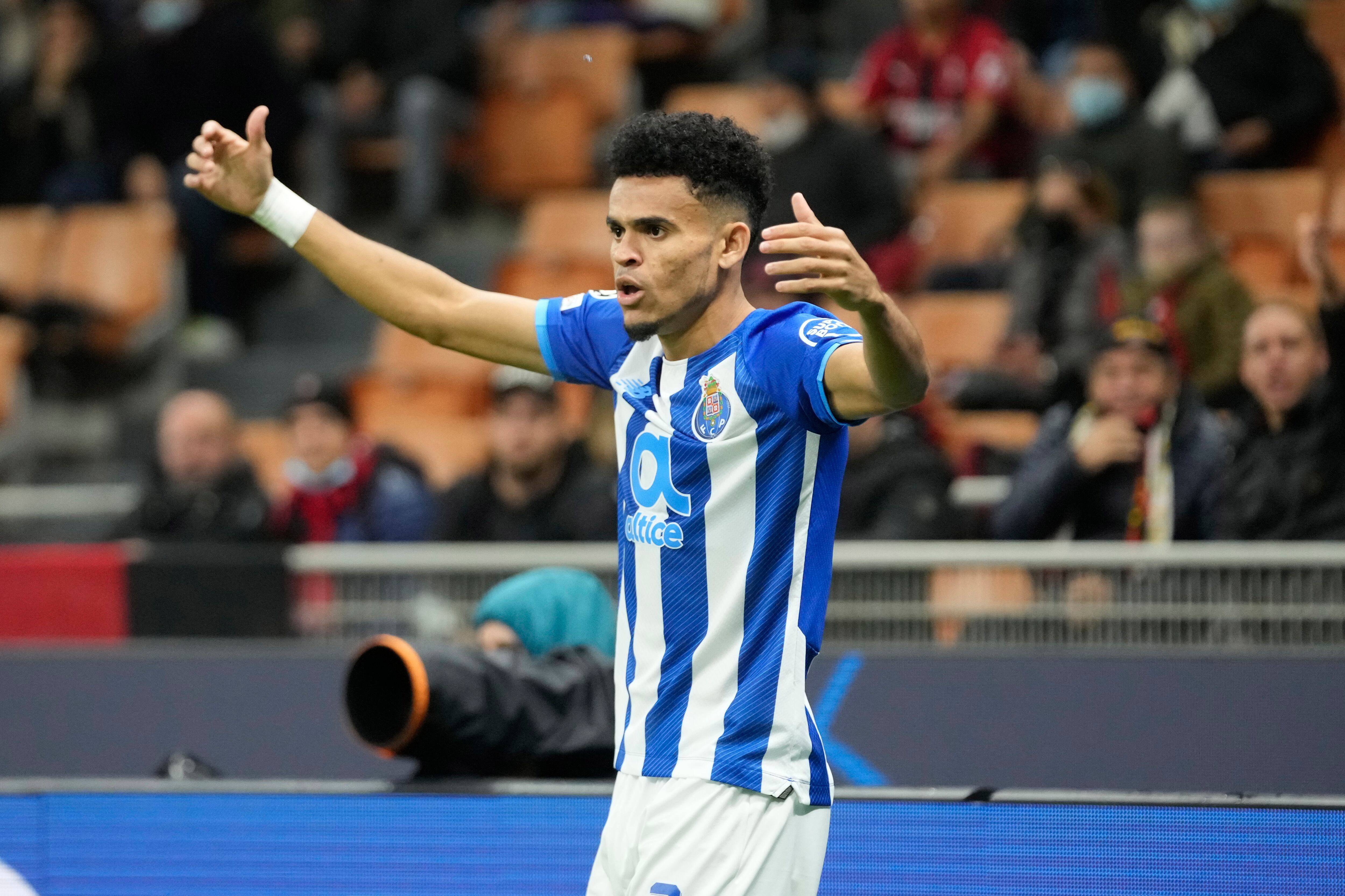 Porto's Luis Diaz celebrates after scoring his side's opening goal during the Champions League group B soccer match between AC Milan and Porto at the San Siro stadium in Milan, Italy, Wednesday, Nov. 3, 2021. (AP Photo/Luca Bruno)