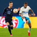 Malmo's Veljko Birmancevic, left, challenges for the ball with Zenit's Wilmar Barrios during the Champions League, group H, soccer match, between Zenit St. Petersburg and Malmo at the Gazprom Arena in St.Petersburg, Russia, Wednesday, Sept. 29, 2021. (AP Photo/Dmitry Lovetsky)