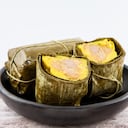 Traditional Colombian tamale as made on Santander region isolated on white background