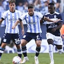 AVELLANEDA, ARGENTINA - FEBRUARY 13: Gabriel Hauche of Racing Club fights for the ball with Johan Carbonero of Gimnasia during a match between Racing Club and Gimnasia y Esgrima La Plata as part of Copa de la Liga 2022 at Presidente Peron Stadium on February 12, 2022 in Avellaneda, Argentina. (Photo by Rodrigo Valle/Getty Images)