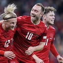 Denmark's Kasper Dolberg, second left, celebrates scoring with teammates Christian Eriksen, center right, Joachim Maehle and Andreas Skov Olsen, right, during the UEFA Nations League soccer match between Denmark and France at Parken Stadium in Copenhagen, Denmark, Sunday Sept. 25, 2022. (Liselotte Sabroe/Ritzau Scanpix via AP)