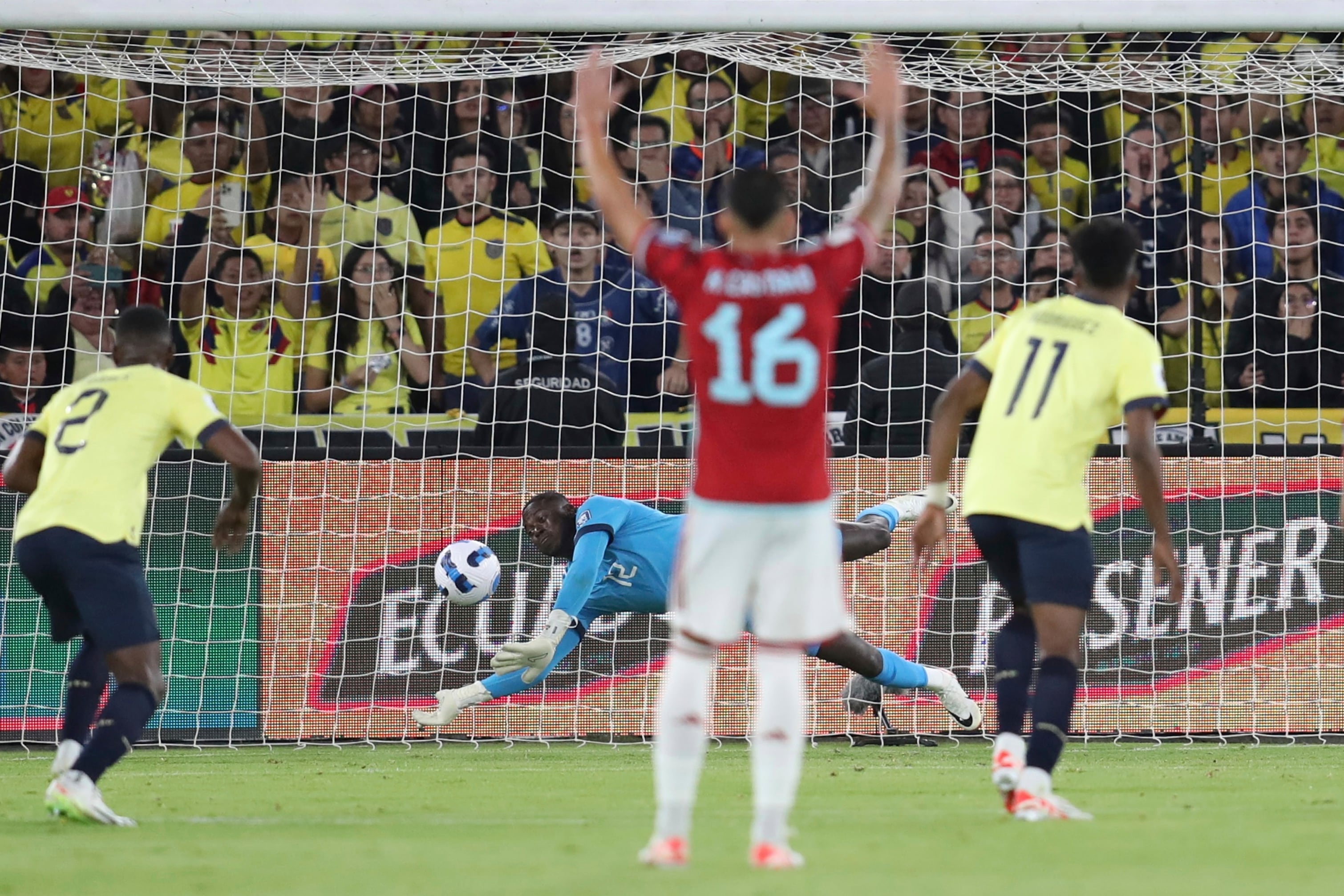 Ecuador's goalkeeper Moises Ramirez, center, stops a penalty kick by Colombia's Luis Diaz during a qualifying soccer match for the FIFA World Cup 2026 at the Rodrigo Paz Delgado stadium in Quito, Ecuador, Tuesday, Oct. 17, 2023. (AP Photo/Patricio Teran)