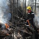 This July 2, 2023, image released by the French General Directorate for Civil Protection and Crisis Management (DGSCGC) shows a French firefighter battling wildfires in the Abitibi-T�miscamingue region of Quebec, more than 650kms (400 miles) north of Montreal. A record 22.7 million acres (9.2 million hectares) have burned so far by wildfires raging across Canada, according to the Canadian Interagency Forest Fire Centre on July 10, 2023. (Photo by Carlo ZAGLIA / General Directorate for Civil Protection and Crisis Management / AFP) / RESTRICTED TO EDITORIAL USE - MANDATORY CREDIT "AFP PHOTO / Carlo ZAGLIA/DGSCGC" - NO MARKETING NO ADVERTISING CAMPAIGNS - DISTRIBUTED AS A SERVICE TO CLIENTS