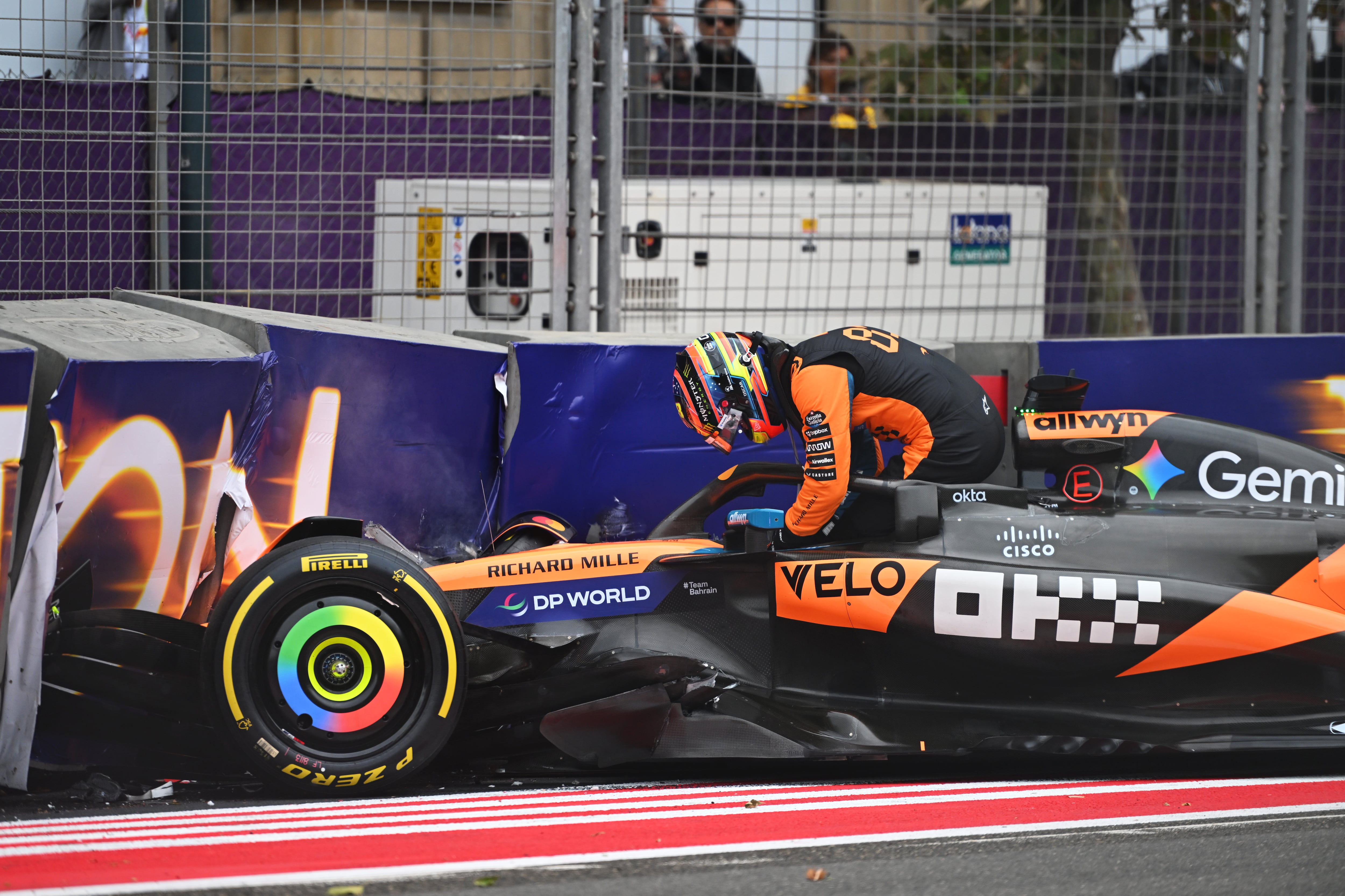 BAKU, AZERBAIJAN - SEPTEMBER 21: Oscar Piastri of Australia and McLaren climbs out of his damaged car after a crash during the F1 Grand Prix of Azerbaijan at Baku City Circuit on September 21, 2025 in Baku, Azerbaijan. (Photo by Rudy Carezzevoli/Getty Images)