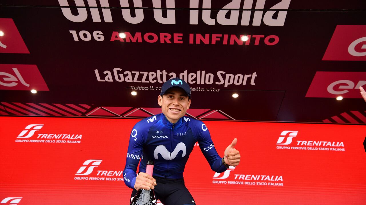 Colombia's Einer Rubio Reyes poses on podium after winning the 13rd stage of the Giro D'Italia, tour of Italy cycling race, from Borgofranco D'Ivrea to Crans Montana, Friday, May 19, 2023. (Massimo Paolone/LaPresse via AP)