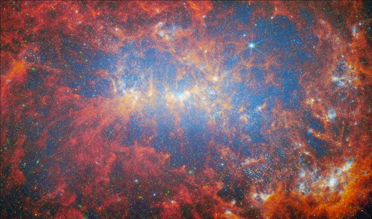 El telescopio espacial James Webb observó la galaxia NGC 4449 con un "estallido estelar", como se ve en esta imagen publicada el 29 de mayo de 2024