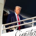 Former President Donald Trump steps off his plane as he arrives at Hartsfield-Jackson Atlanta International Airport, Thursday, Aug. 24, 2023, in Atlanta. (AP Photo/Alex Brandon)