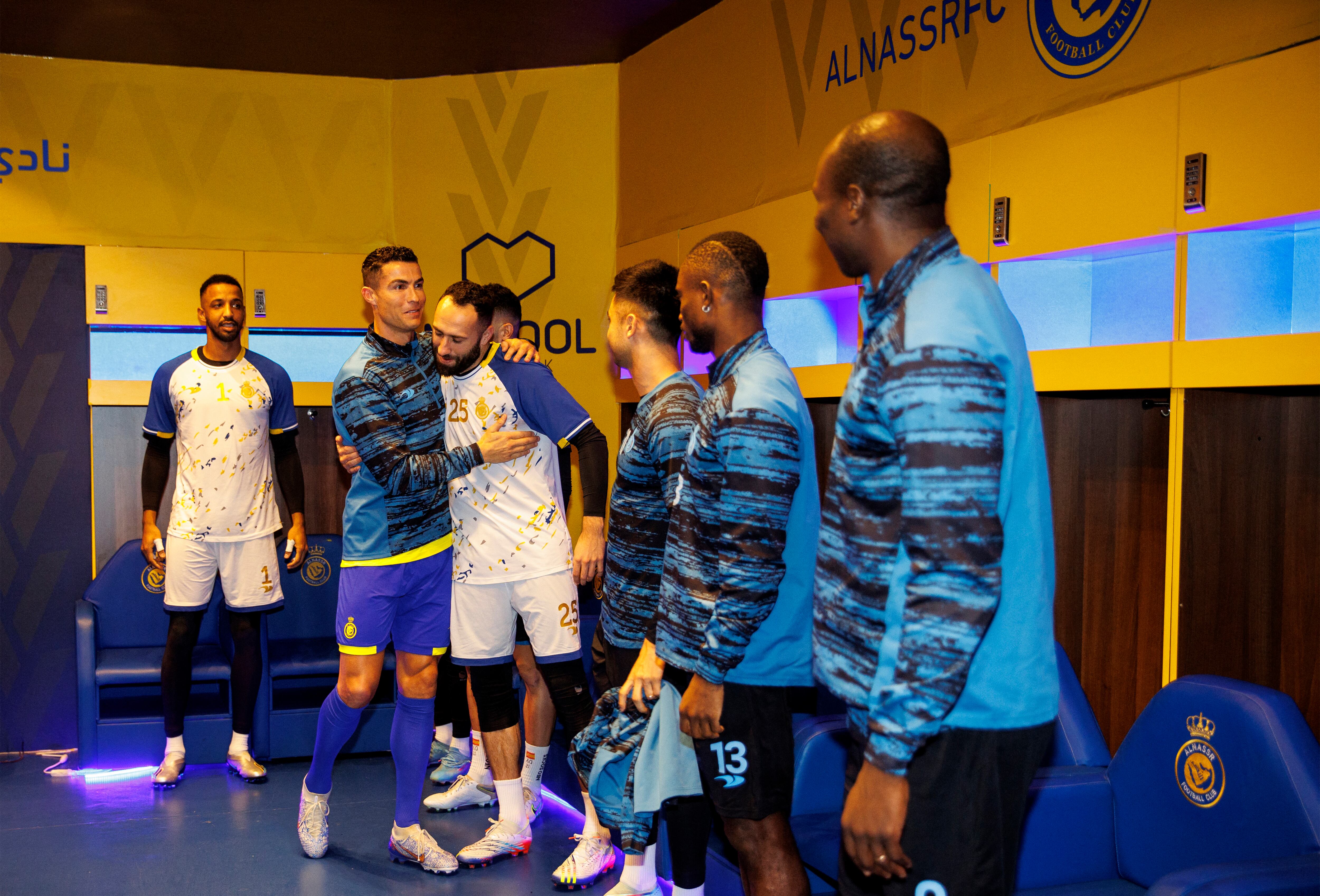 A handout picture released by Saudi Arabia's al-Nassr football club shows Al-Nassr's new Portuguese forward Cristiano Ronaldo greeting teammates during his unveiling ceremony at the Mrsool Park Stadium in the Saudi capital Riyadh on January 3, 2023. (Photo by Jorge Ferrari / Al Nassr Football Club / AFP) / == RESTRICTED TO EDITORIAL USE - MANDATORY CREDIT "AFP PHOTO / HO /AL NASSR FOOTBALL CLUB" - NO MARKETING NO ADVERTISING CAMPAIGNS - DISTRIBUTED AS A SERVICE TO CLIENTS ==