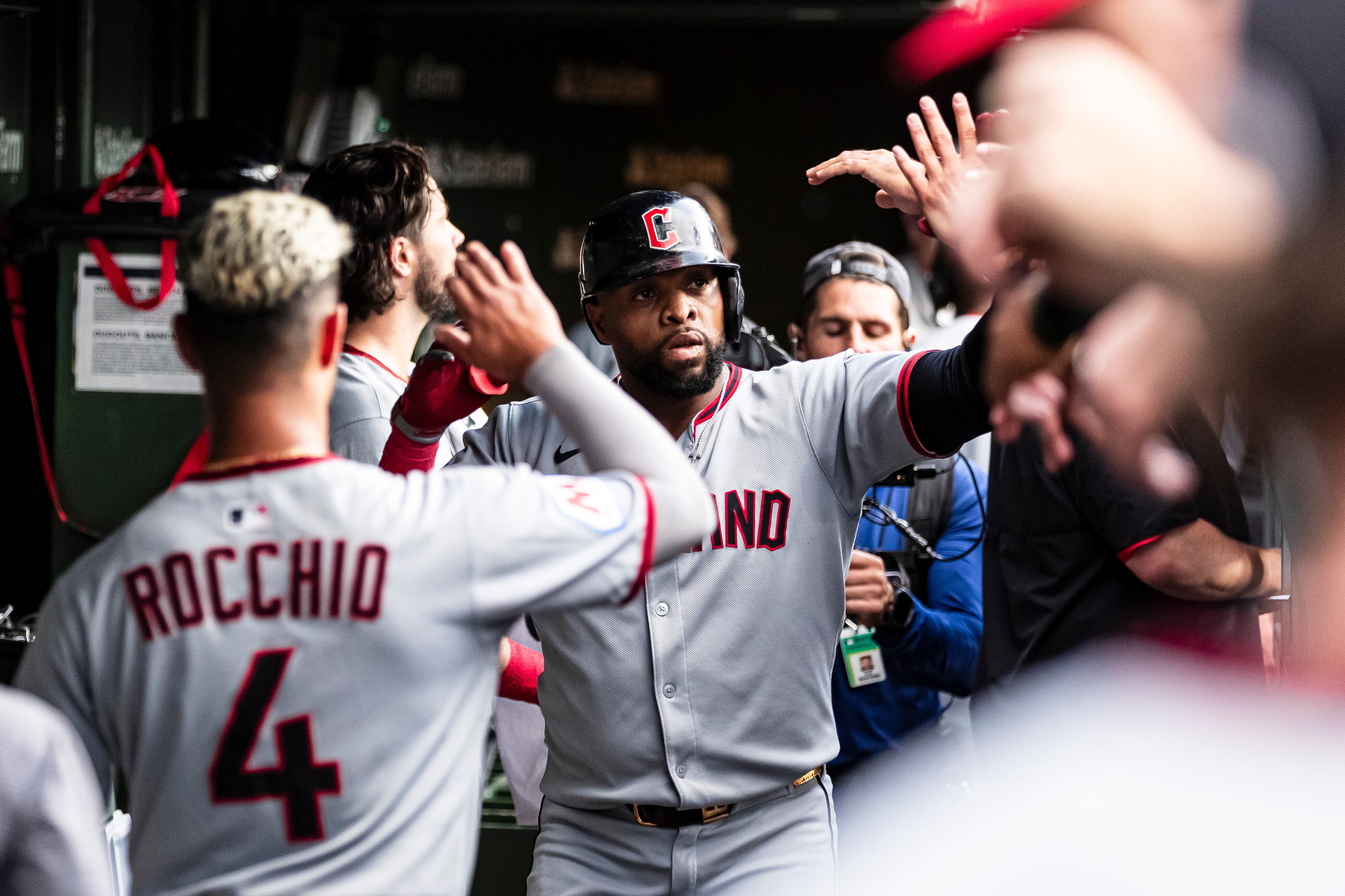 CHICAGO, ILLINOIS - JULY 02: Carlos Santana #41 of the Cleveland Guardians high-fives teammates after hitting a solo home run in the second inning against the Chicago Cubs at Wrigley Field on July 02, 2025 in Chicago, Illinois. (Photo by Griffin Quinn/Getty Images)