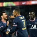 PSG's Kylian Mbappe, centre, celebrates with PSG's Lionel Messi after scoring his side's second goal during the French League One soccer match between Paris Saint-Germain and Monaco at the Parc des Princes stadium in Paris, France, Sunday, Dec. 12, 2021. (AP Photo/Christophe Ena)