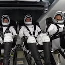 This video grab image courtesy of NASA TV shows (From L) ESA (European Space Agency) astronaut Thomas Pesquet, NASA astronauts Megan McArthur and Shane Kimbrough, and Japan Aerospace Exploration Agency (JAXA) astronaut Akihiko Hoshide, inside the capsule at launch pad at Launch Complex 39A ahead of the Crew-2 mission, April 23, 2021, at NASA's Kennedy Space Center in Florida. - SpaceX is set to launch its third crew to the International Space Station early April 23, 2021, reusing a rocket and crew capsule in a human mission for the first time. The Crew-2 mission blasts off from pad 39A at the Kennedy Space Center in Florida at 5:49 am Eastern Time (0949 GMT), after being delayed a day by adverse weather along the flight path. (Photo by - / NASA TV / AFP) / RESTRICTED TO EDITORIAL USE - MANDATORY CREDIT "AFP PHOTO / NASA TV " - NO MARKETING - NO ADVERTISING CAMPAIGNS - DISTRIBUTED AS A SERVICE TO CLIENTS /