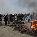 Residents gather after Taliban forces fired mortars at Pakistan's border town of Chaman on December 11, 2022. - Afghan Taliban forces opened fire at a border crossing with Pakistan on December 11, killing six civilians, the Pakistani military said. More than a dozen people were wounded by the "unprovoked and indiscriminate fire" near the town of Chaman in Balochistan province, the military added. (Photo by Abdul BASIT / AFP)