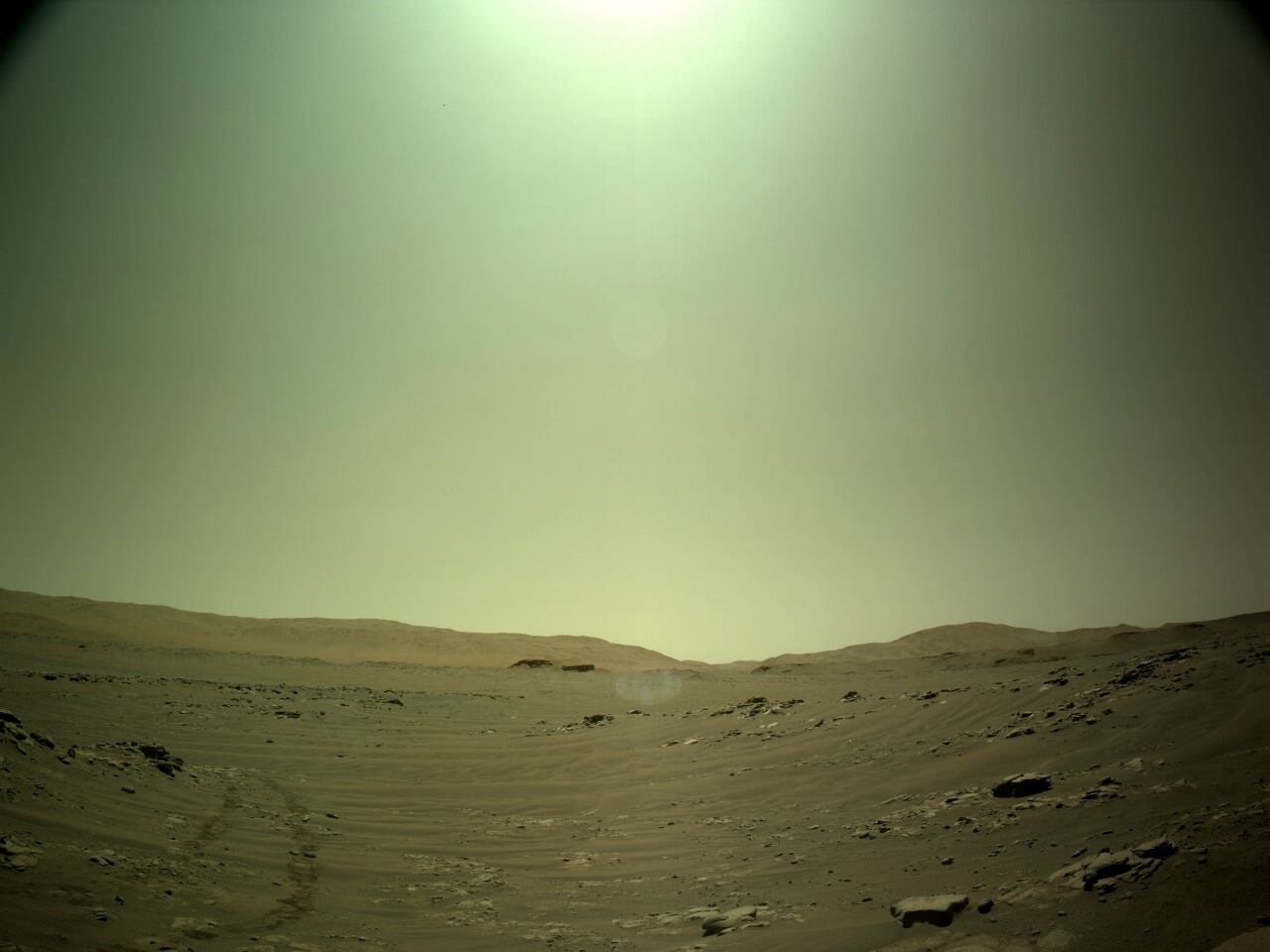 NASA's Mars Perseverance rover acquired this image using its onboard Left Navigation Camera (Navcam). The camera is located high on the rover's mast and aids in driving.   This image was acquired on Oct. 25, 2021 (Sol 242) at the local mean solar time of 12:59:15.