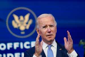 President-elect Joe Biden speaks at The Queen theater in Wilmington, Del., Wednesday, Jan. 6, 2021. Biden has called the violent protests on the U.S. Capitol "an assault on the most sacred of American undertakings: the doing of the people's business." (AP Photo/Susan Walsh)