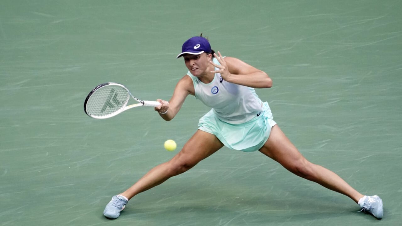 Iga Swiatek, of Poland, returns a shot to Ons Jabeur, of Tunisia, during the women's singles final of the U.S. Open tennis championships, Saturday, Sept. 10, 2022, in New York. (AP/Mary Altaffer)