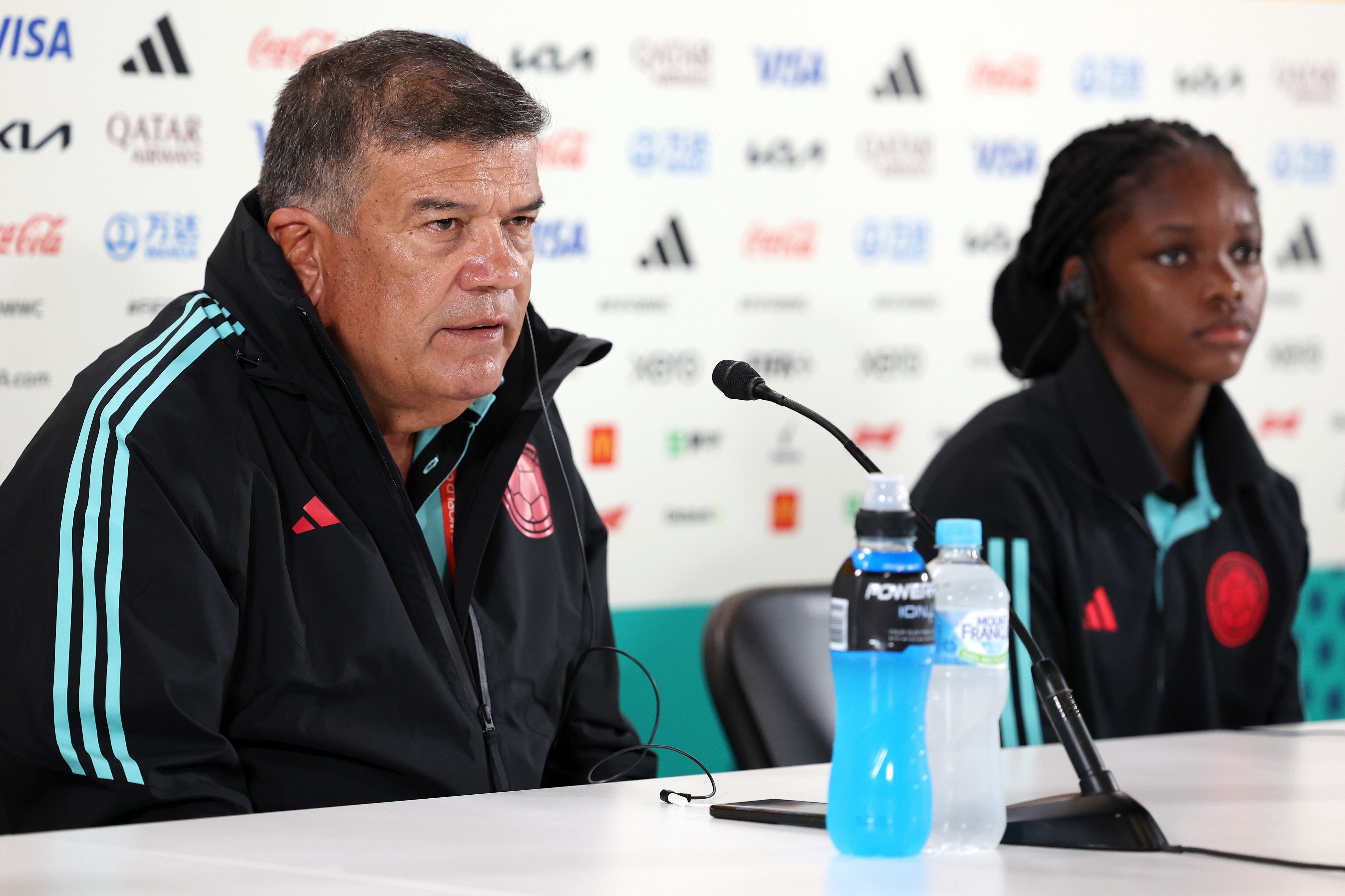SYDNEY, AUSTRALIA - JULY 24: Colombia head coach Nelson Abadia answers questions from the media with Linda Caicedo of Colombia during the Colombia Press Conference on July 24, 2023 in Sydney / Gadigal, Australia. (Photo by Maddie Meyer - FIFA/FIFA via Getty Images)