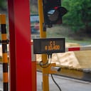 Red light at a toll traffic light on a Colombian highway.
