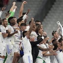 Real Madrid's Marcelo, center right, lifts the trophy after winning the Champions League final soccer match between Liverpool and Real Madrid at the Stade de France in Saint Denis near Paris, Saturday, May 28, 2022. Real Madrid defeated Liverpool 1-0. (AP Photo/Kirsty Wigglesworth)