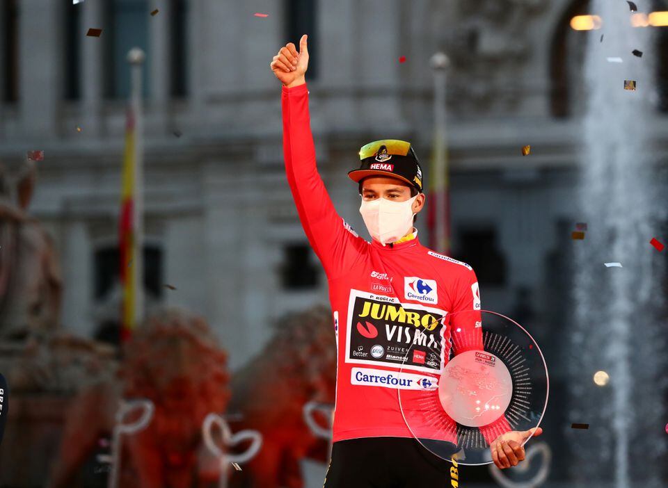 Cycling - Vuelta a Espana - Stage 18 - Hipodromo de la Zarzuela to Madrid, Spain - November 8, 2020 Jumbo-Visma's Primoz Roglic celebrates with a trophy on the podium after winning the general classification REUTERS/Sergio Perez/File Photo