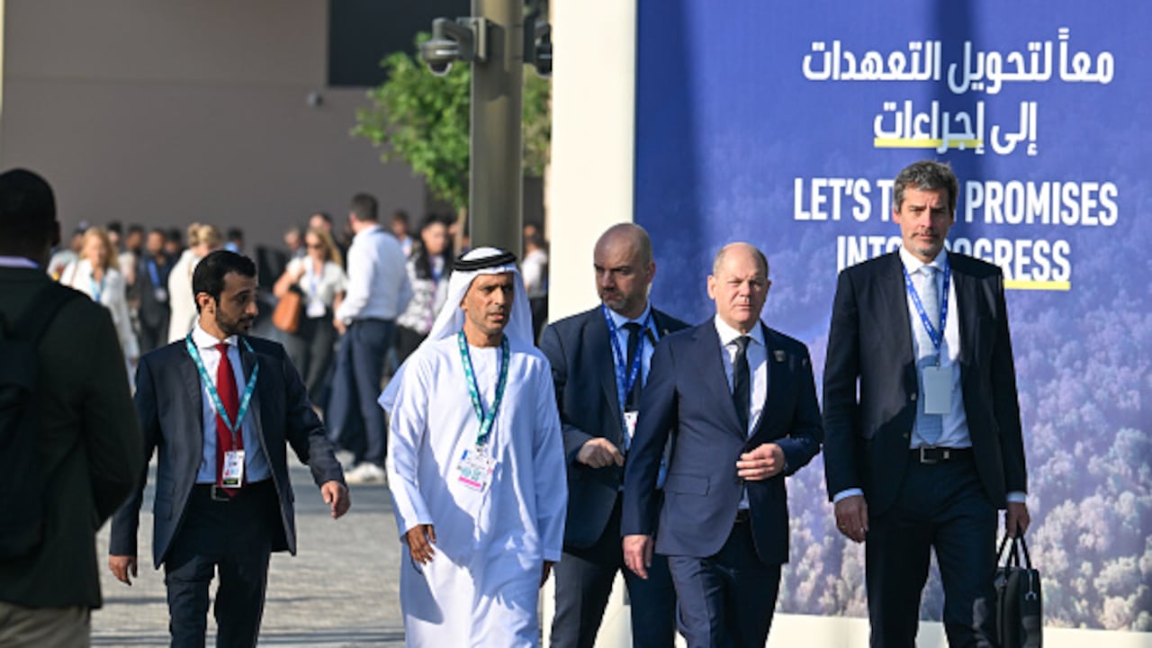 02 December 2023, United Arab Emirates, Dubai: Federal Chancellor Olaf Scholz (SPD, 2nd from right) arrives on the second day of his visit to the United Nations Climate Change Conference (COP28). Photo: Soeren Stache/dpa (Photo by Soeren Stache/picture alliance via Getty Images)