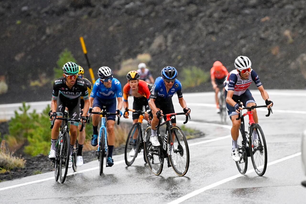 Italy's Vincenzo Nibali, right, leads the pack during the third stage of the Giro d'Italia, tour of Italy cycling race from Enna to Etna, Sicily, Monday, Oct. 5, 2020. (Fabio Ferrari/LaPresse via AP)
