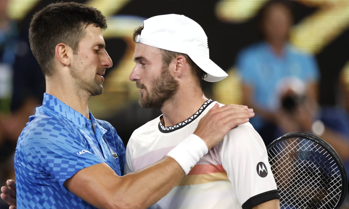 Novak Djokovic, left, of Serbia is congratulated by Tommy Paul of the U.S. after their semifinal at the Australian Open tennis championship in Melbourne, Australia, Friday, Jan. 27, 2023. (AP/Asanka Brendon Ratnayake)