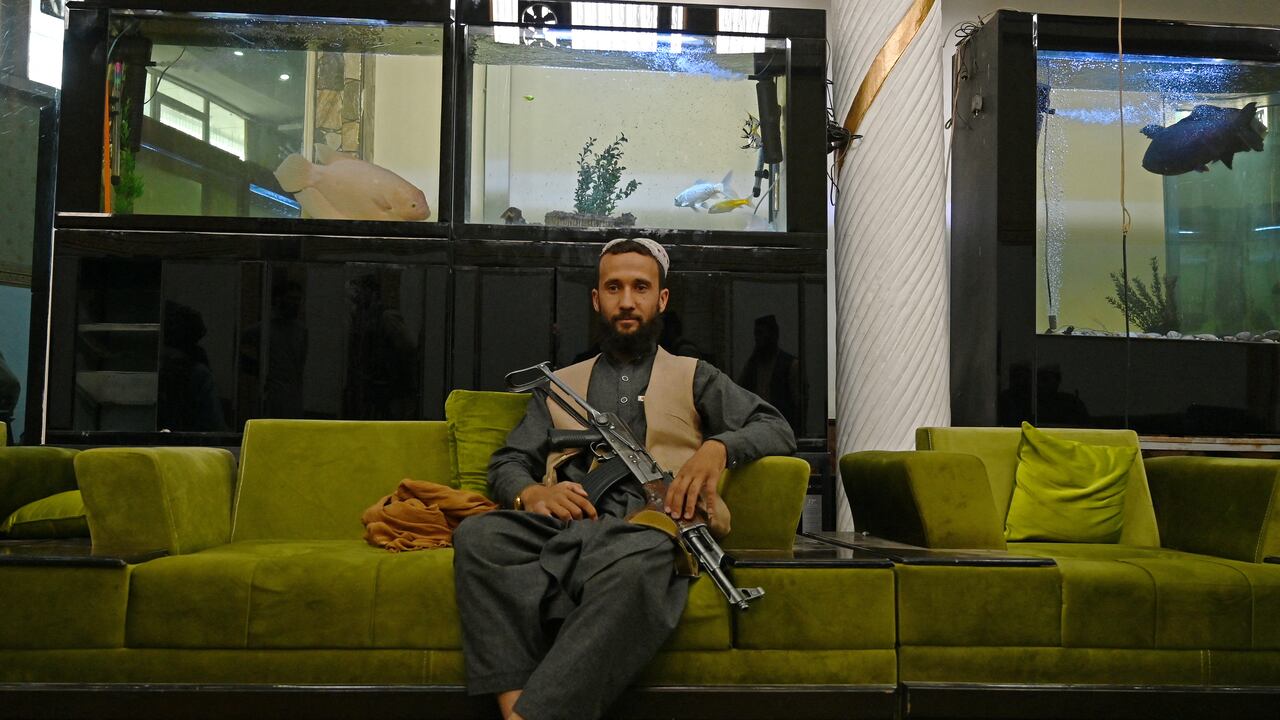 In this picture taken on September 11, 2021, a member of the Taliban visits the greenhouse yard at the home of the Afghan warlord Abdul Rashid Dostum in the Sherpur neighborhood of Kabul. - Taliban fighters have taken over the glitzy Kabul mansion of one of their fiercest enemies -- the warlord and fugitive ex-vice president Dostum. (Photo by Wakil KOHSAR / AFP) / TO GO WITH 'Afghanistan-Conflict-Dostum', SCENE by Emmanuel DUPARCQ
