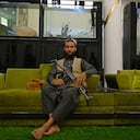 In this picture taken on September 11, 2021, a member of the Taliban visits the greenhouse yard at the home of the Afghan warlord Abdul Rashid Dostum in the Sherpur neighborhood of Kabul. - Taliban fighters have taken over the glitzy Kabul mansion of one of their fiercest enemies -- the warlord and fugitive ex-vice president Dostum. (Photo by Wakil KOHSAR / AFP) / TO GO WITH 'Afghanistan-Conflict-Dostum', SCENE by Emmanuel DUPARCQ