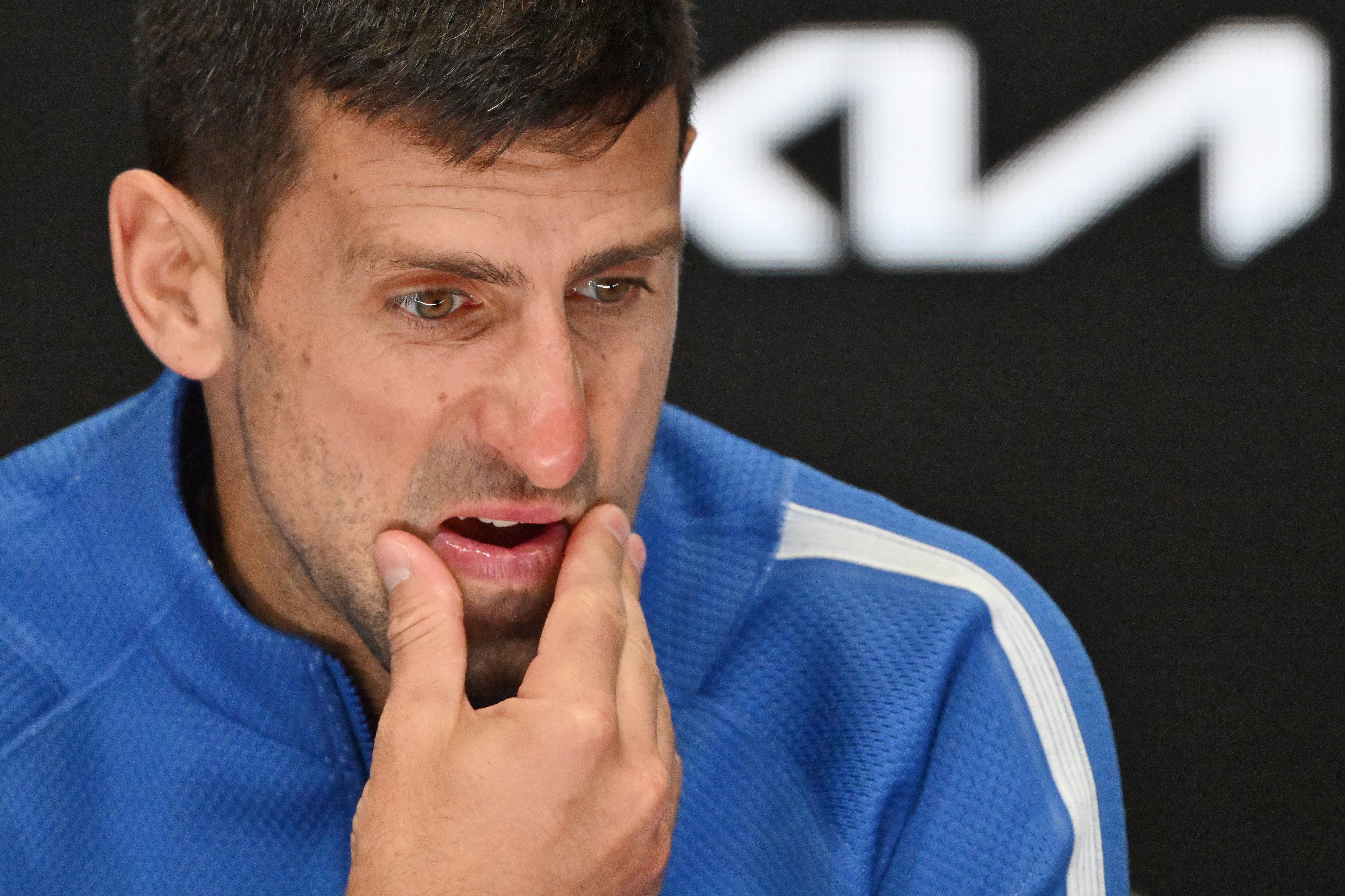 Serbia's Novak Djokovic attends a press conference after losing against Italy's Jannik Sinner in their men's singles semi-final match on day 13 of the Australian Open tennis tournament in Melbourne on January 26, 2024. (Photo by Saeed KHAN / AFP) / -- IMAGE RESTRICTED TO EDITORIAL USE - STRICTLY NO COMMERCIAL USE --