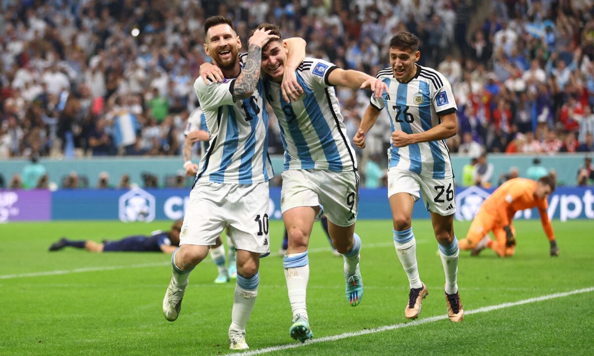 Soccer Football - FIFA World Cup Qatar 2022 - Semi Final - Argentina v Croatia - Lusail Stadium, Lusail, Qatar - December 13, 2022 Argentina's Julian Alvarez celebrates scoring their second goal with Lionel Messi and Nahuel Molina REUTERS/Carl Recine