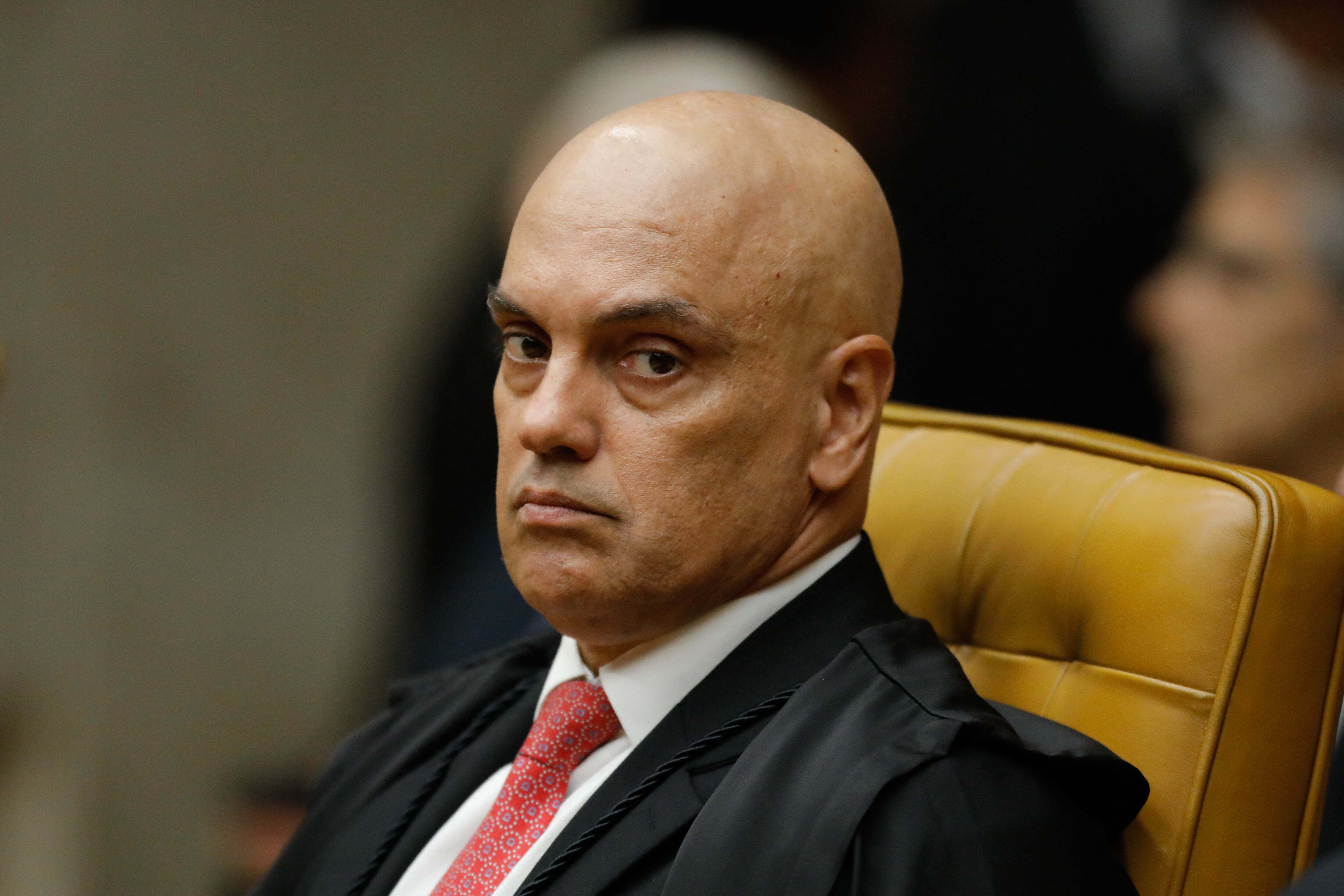 (FILES) Brazilian Supreme Court judge Alexandre de Moraes attends the solemn opening session of the 2024 judicial year in Brasilia on February 1, 2024. A Supreme Court judge in Brazil ordered an investigation of Elon Musk on April 7, 2024, after the mogul criticized the magistrate and accused him of censorship for blocking accounts suspected of spreading disinformation. In an order seen by AFP, Judge Alexandre de Moraes accused the owner of X, formerly Twitter, of "criminal instrumentalization of X." (Photo by Sergio Lima / AFP)