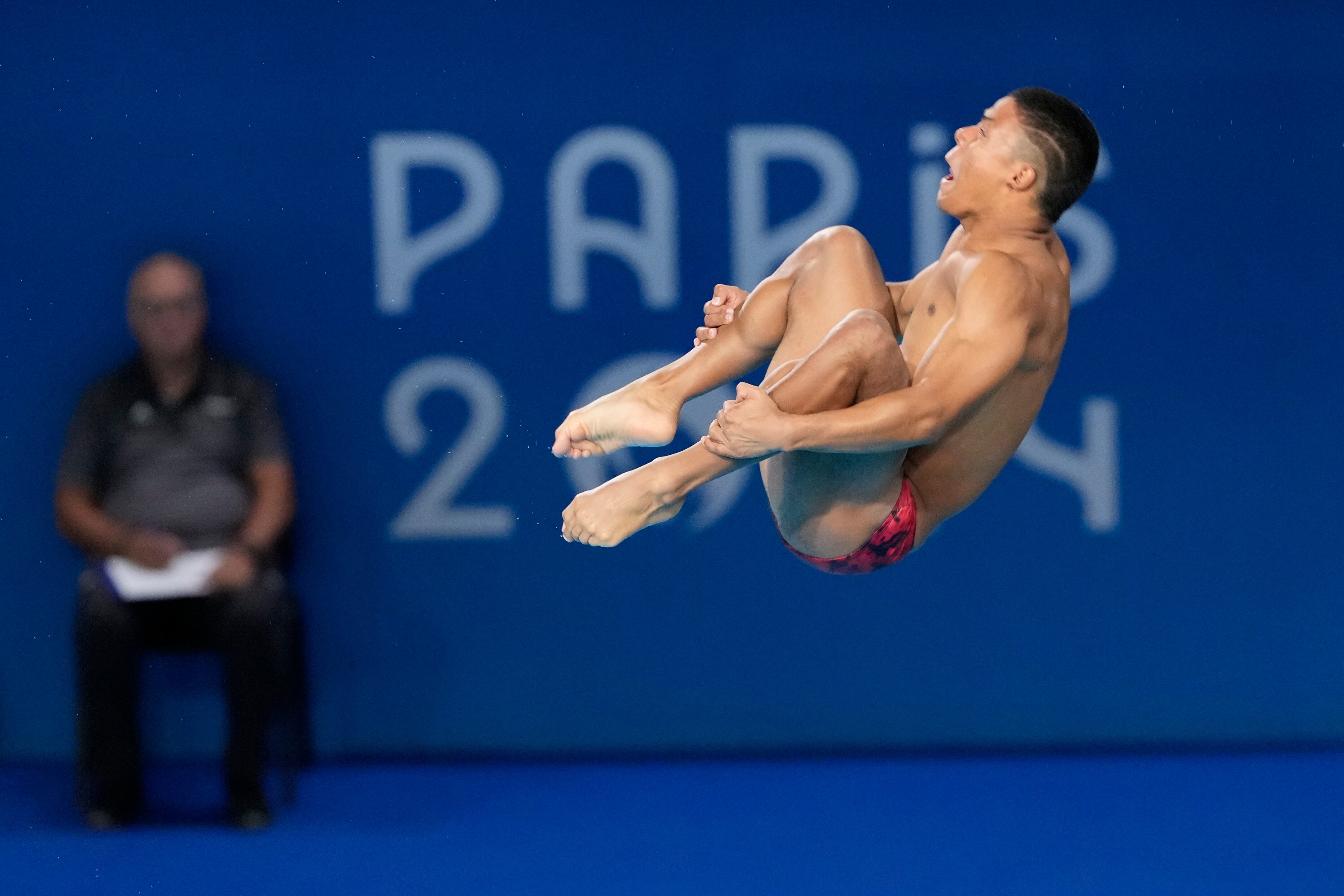 Colombia's Luis Felipe Uribe Bermudez competes in the men's 3m springboard diving semifinal, at the 2024 Summer Olympics, Wednesday, Aug. 7, 2024, in Saint-Denis, France. (AP Photo/Lee Jin-man)