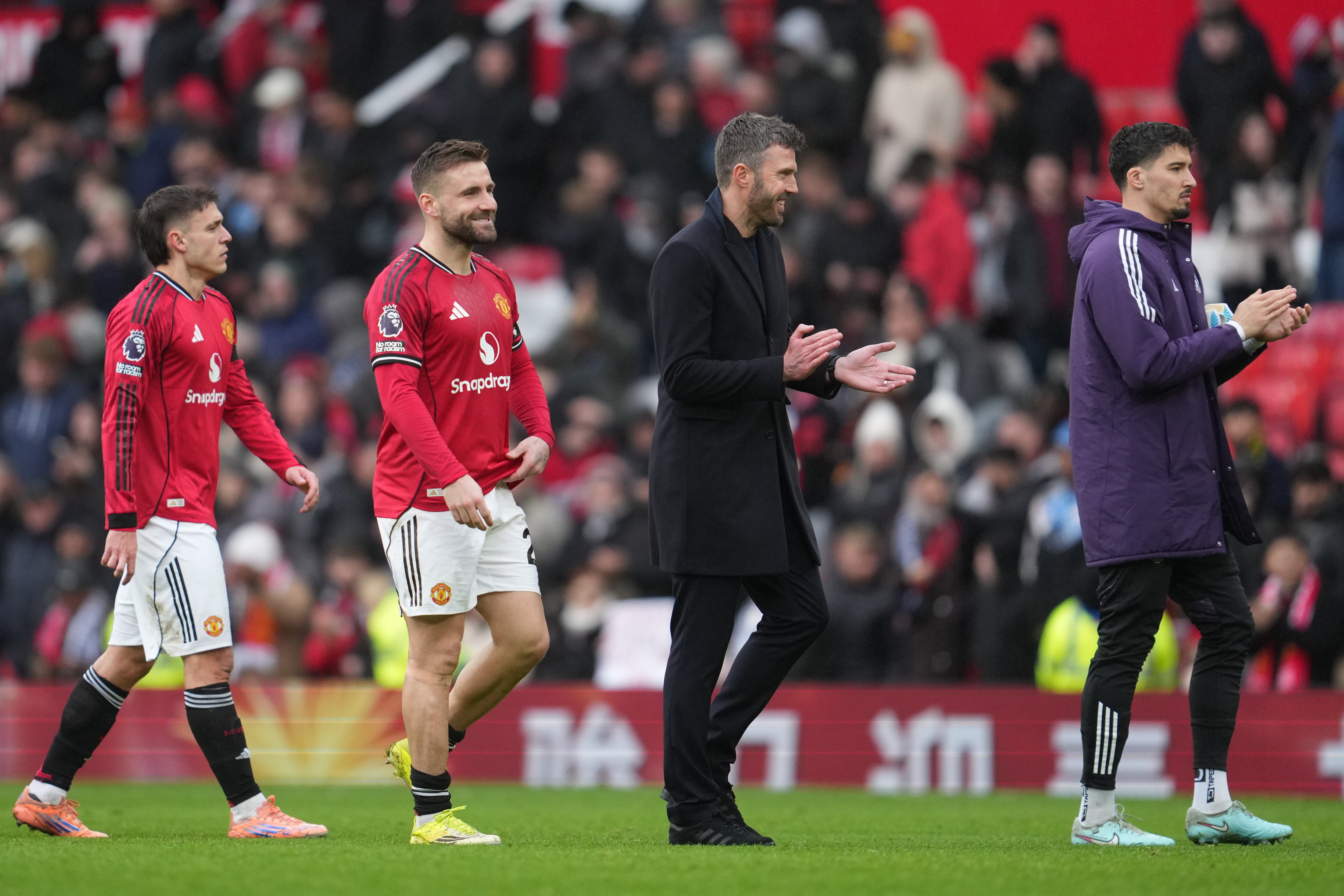 Manchester United's coach Michael Carrick walks off the pitch after the English Premier League soccer match between Manchester United and Tottenham in Manchester, England, Saturday, Feb. 7, 2026. (AP Photo/Jon Super)
