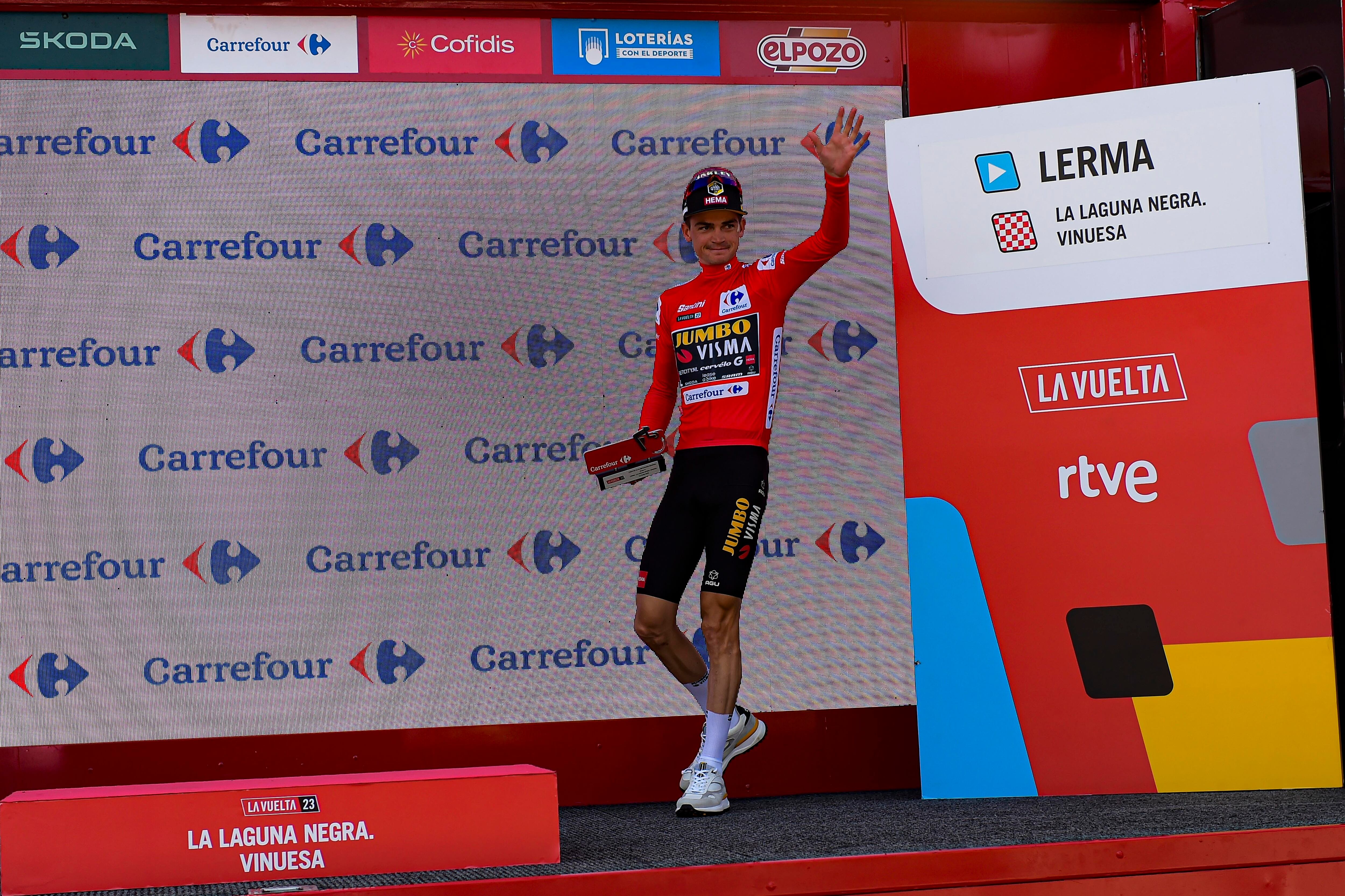 Jumbo Visma's Sepp Kuss, center, leader of the race on the podium at the end of the eleventh stage of La Vuelta between Lerma and La Laguna Negra-Vinuesa, 163 km (101 miles) in Vinuesa, northern Spain, Wednesday, Sept. 6 2023. (AP Photo/Alvaro Barrientos)