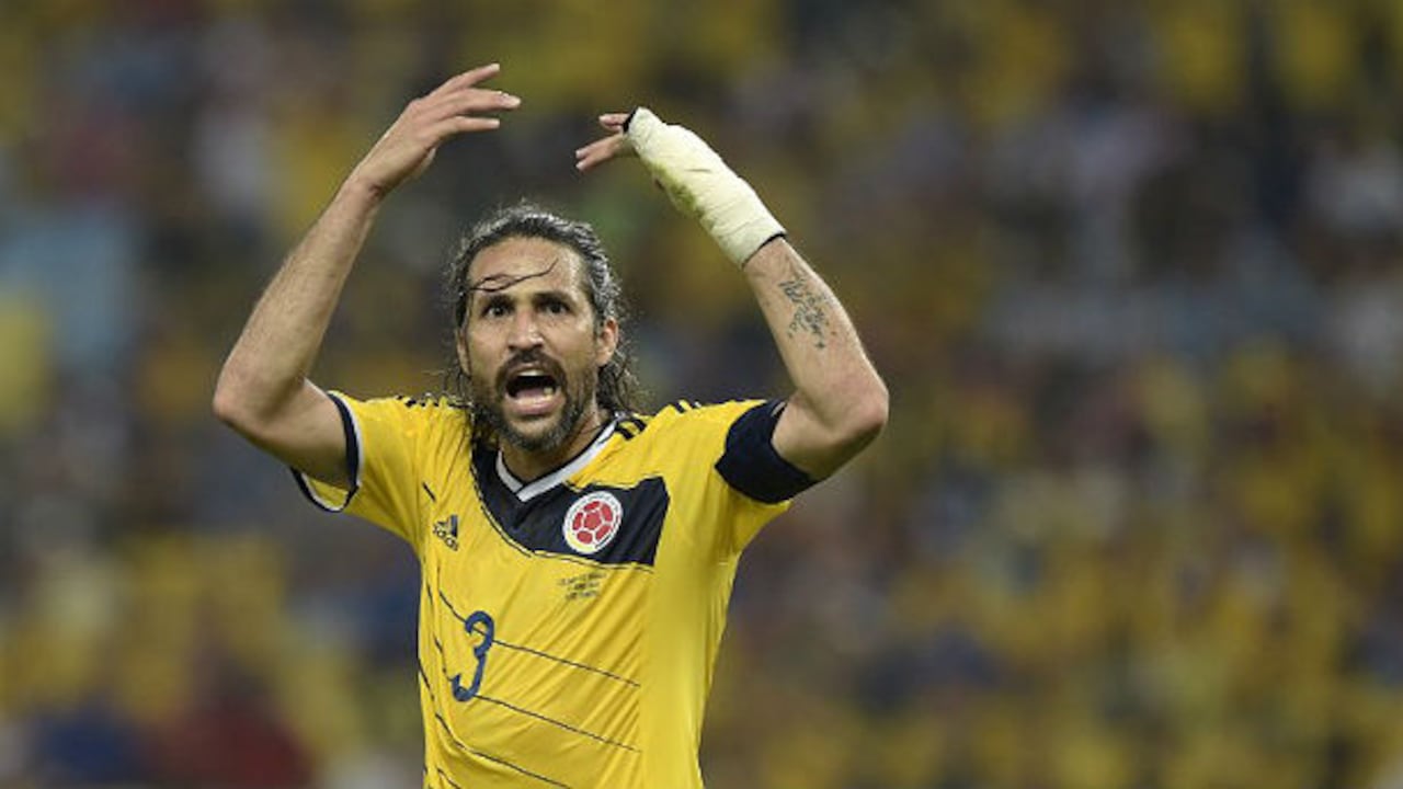 Mario Yepes celebra a rabiar después de ganarle en octavos de final a Uruguay en el Maracaná. Foto: AFP.