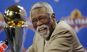 FILE - NBA great Bill Russell reacts at a news conference as he learns the most valuable player award for the NBA basketball championships has been renamed the Bill Russell NBA Finals Most Valuable Player Award, Feb. 14, 2009, in Phoenix. Russell has died at age 88. His family said on social media that Russell died on Sunday, July 31, 2022. Russell anchored a Boston Celtics dynasty that won 11 titles in 13 years. (AP Photo/Matt York, file)