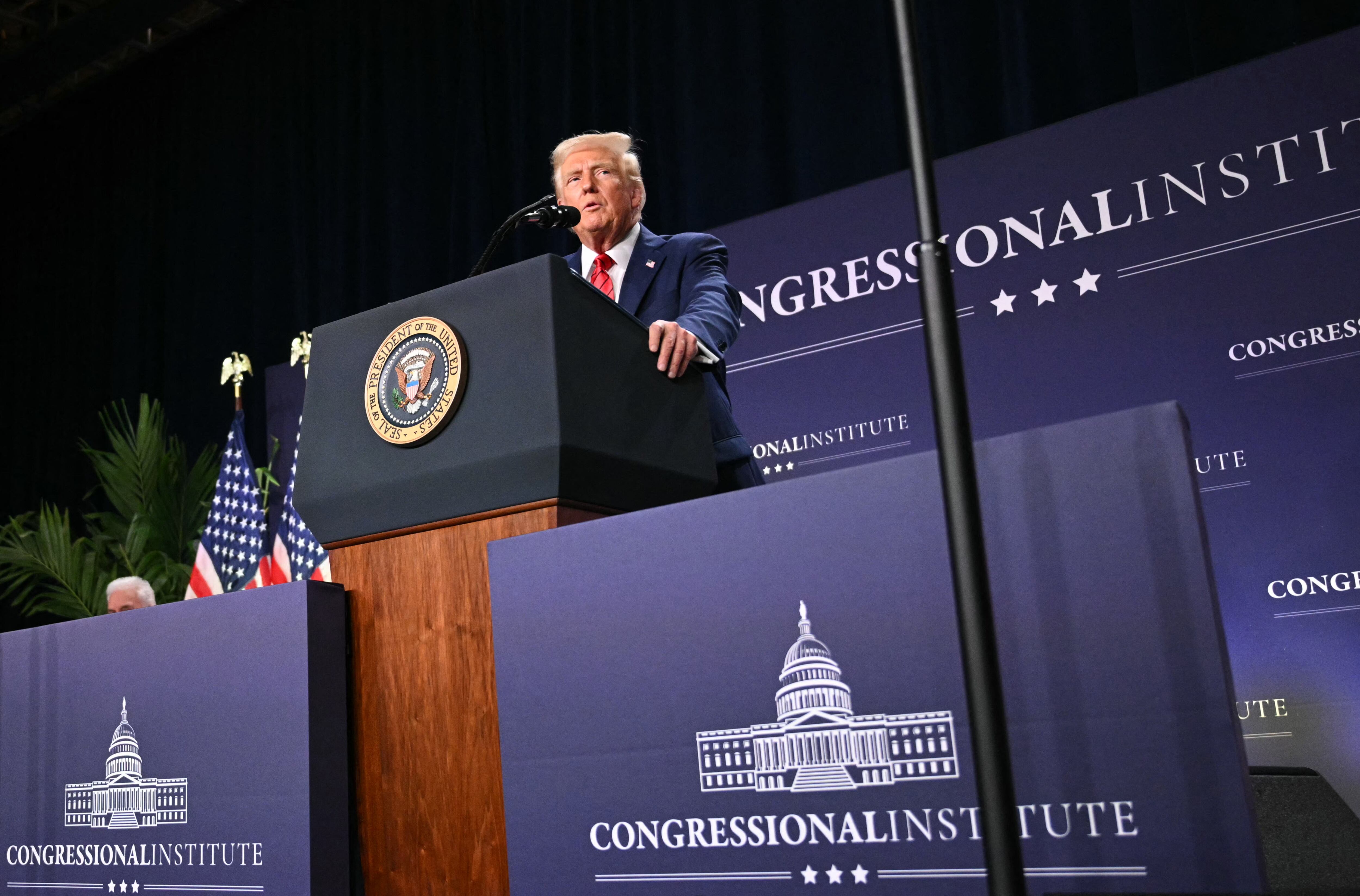 US President Donald Trump speaks at the House Republican Members Conference Dinner at Trump National Doral Miami, in Miami, Florida on January 27, 2025. (Photo by Mandel NGAN / AFP)