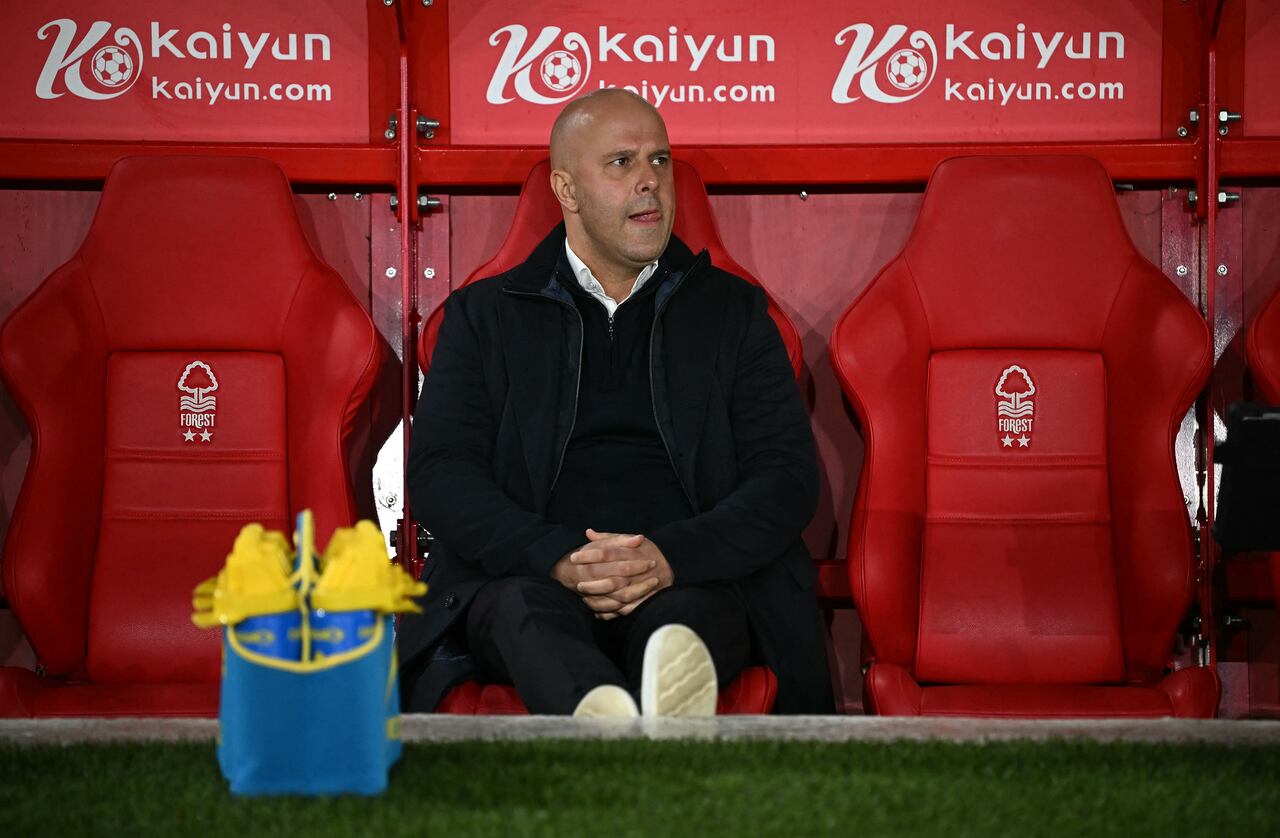Liverpool's Dutch manager Arne Slot reacts ahead of the English Premier League football match between Nottingham Forest and Liverpool at The City Ground in Nottingham, central England, on January 14, 2025. (Photo by Paul ELLIS / AFP) / RESTRICTED TO EDITORIAL USE. No use with unauthorized audio, video, data, fixture lists, club/league logos or 'live' services. Online in-match use limited to 120 images. An additional 40 images may be used in extra time. No video emulation. Social media in-match use limited to 120 images. An additional 40 images may be used in extra time. No use in betting publications, games or single club/league/player publications. /