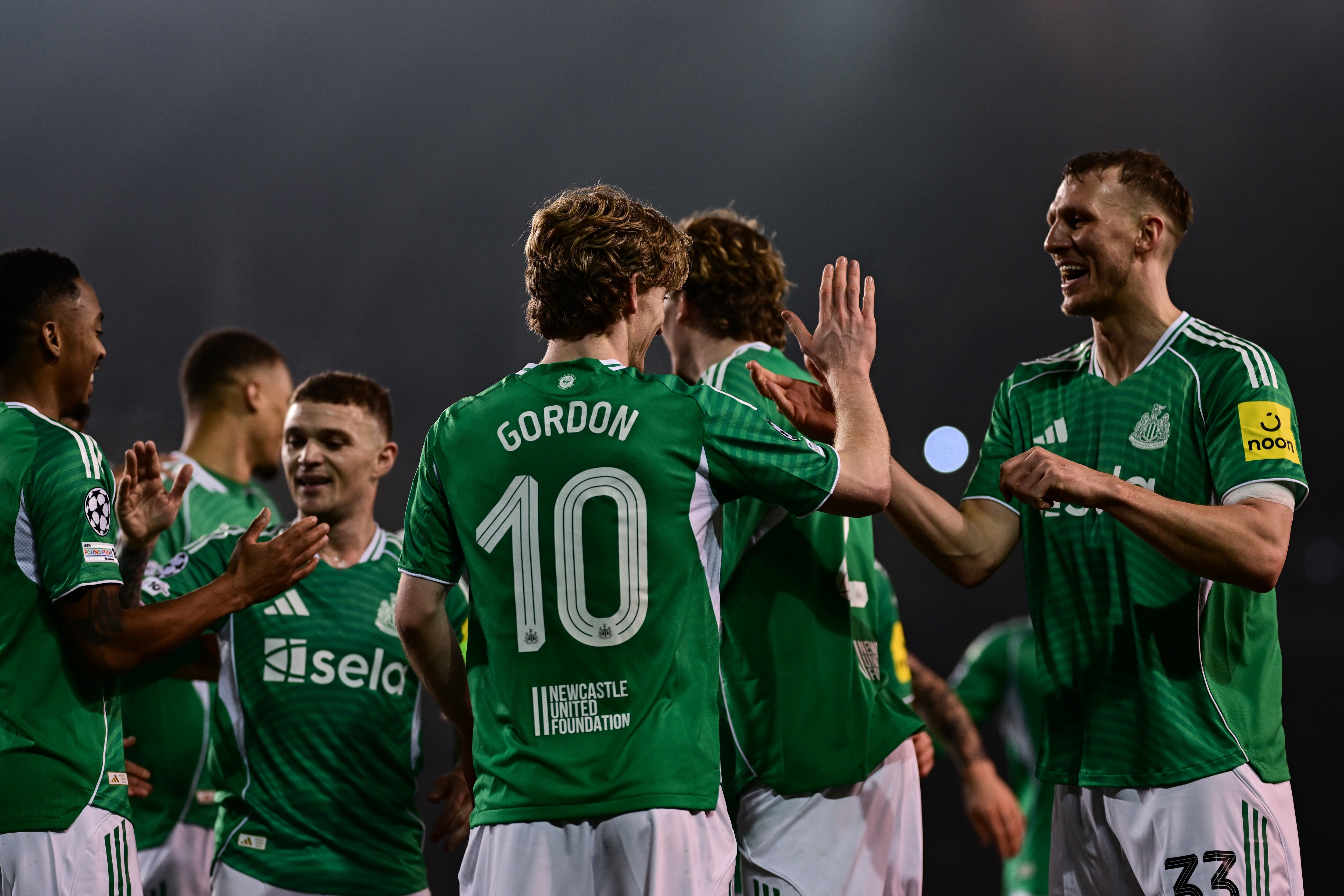 BAKU, AZERBAIJAN - FEBRUARY 18: Anthony Gordon of Newcastle United (10) celebrates with teammates after scoring Newcastle's fourth (and his third) goal during the UEFA Champions League 2025/26 League Knockout Play-off First Leg match between Qarabag FK and Newcastle United FC at Tofiq Bahramov Stadium on February 18, 2026 in Baku, Azerbaijan. (Photo by Serena Taylor/Newcastle United via Getty Images)