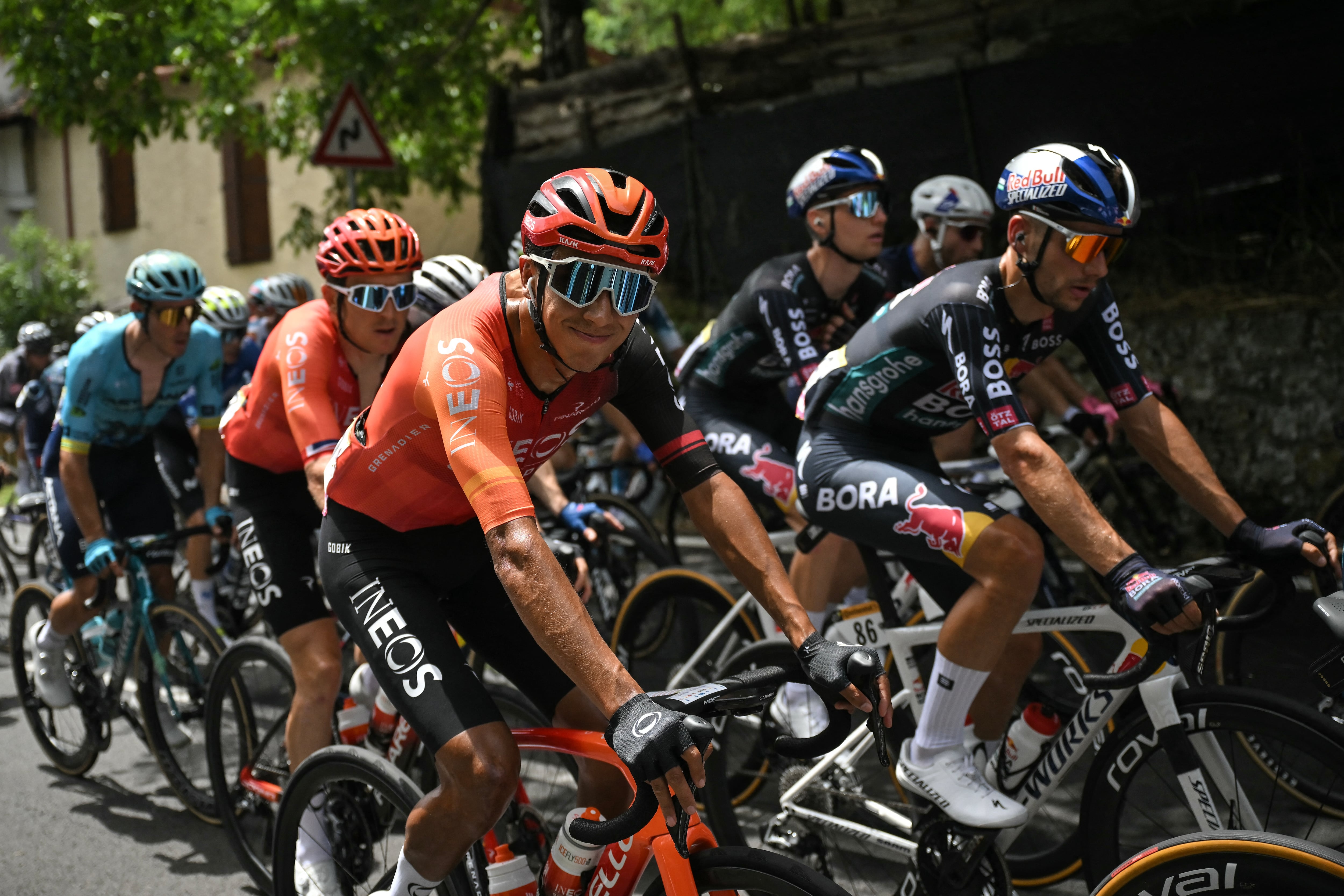 INEOS Grenadiers team's Colombian rider Egan Bernal (C) cycles during the 1st stage of the 111th edition of the Tour de France cycling race, 206 km between Florence and Rimini, in Italy, on June 29, 2024. (Photo by Marco BERTORELLO / AFP)